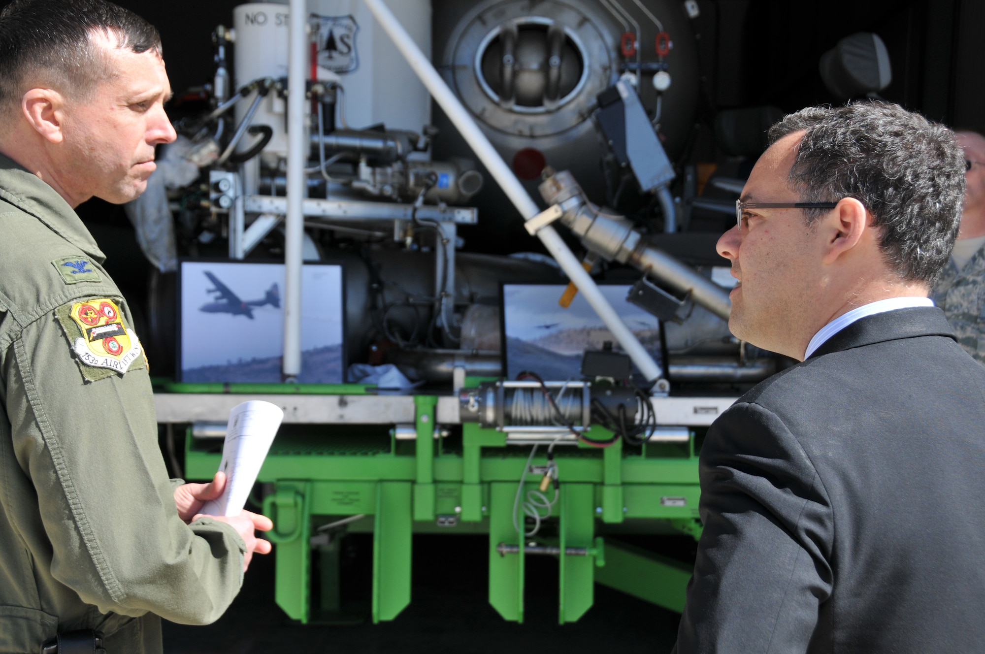 153rd Airlift Wing Commander, Col. Stephen Rader, briefs the Honorable Daniel B. Ginsberg, Assistant Secretary of the Air Force for Manpower and Reserve Affairs, on the Wing's unique aerial firefighting capability while giving him an up-close look at the U.S. Forest Service MAFFS unit. The secretary visited Airmen of the Wyoming Air National Guard, toured facilities and answered questions March 20, 2012. (U.S. Air Force photo by 1st Lt. Rusty Ridley)