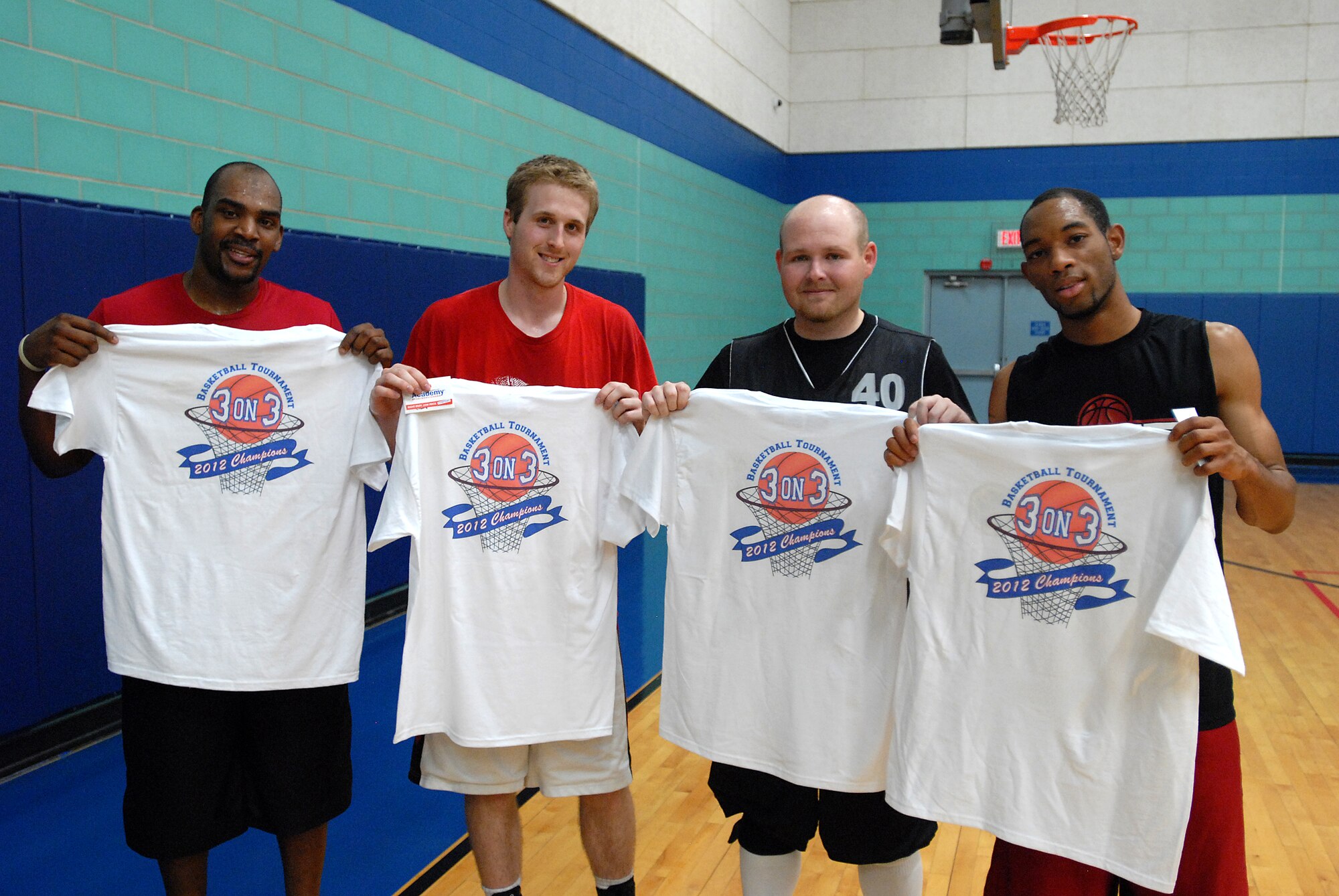GOODFELLOW AIR FORCE BASE, Texas-- Team 14 display their T-shirts commemorating their win of the March Madness 3-on-3 Basketball Tournament, March 24, here. Their team came together and showed what it took to receive the title of champions.  (U.S. Air Force photo/Airman 1st Class Michael Smith)