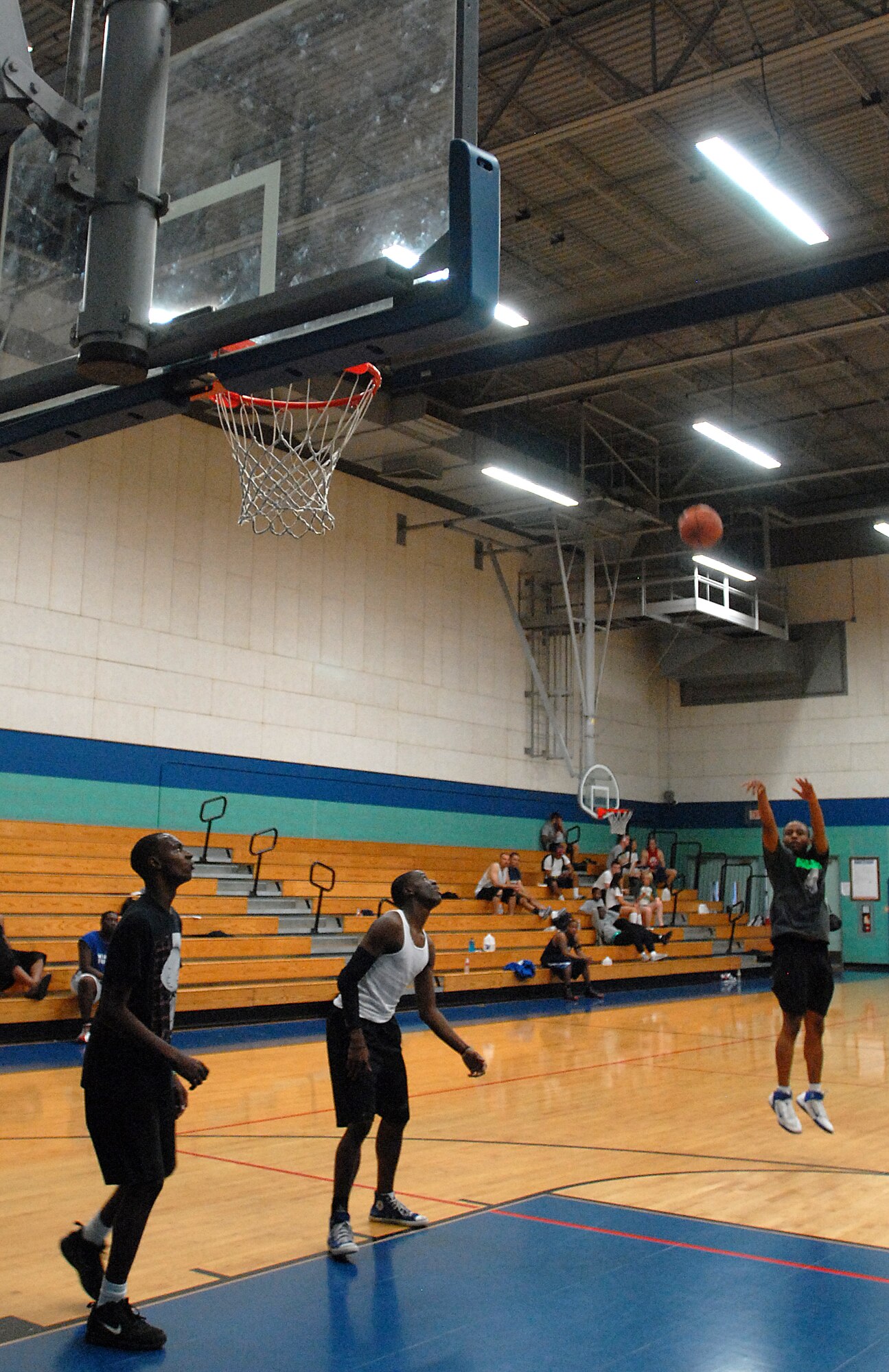 GOODFELLOW AIR FORCE BASE, Texas-- Senior Airman Corey Pasley, 17th Medical Operations Squadron, shoots a jumper during the March Madness 3-on-3 Basketball Tournament, March 24, here. Pasley and his team defeat their competitors, moving them into the final match of the tournament.  (U.S. Air Force photo/Airman 1st Class Michael Smith)