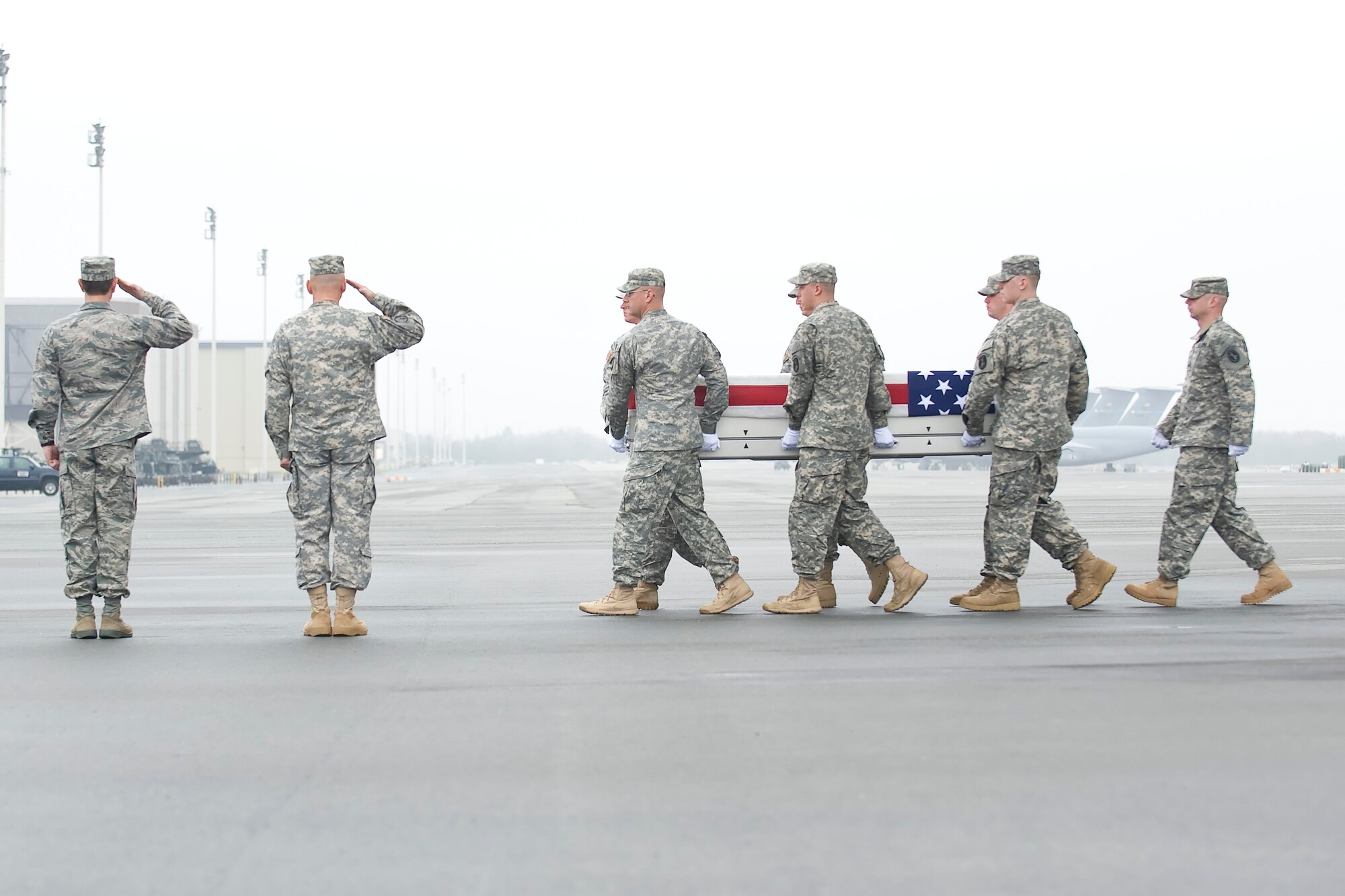 A U.S. Army carry team transfers the remains of Army Spc. Dennis P. Weichel of Providence, R.I., at Dover Air Force Base, Del., March 25, 2012. Weichel was assigned to the 1st Battalion, 143rd Infantry Regiment, 56th Troop Command, Rhode Island National Guard, East Greenwich, R.I. (U.S. Air Force photo/Adrian R. Rowan)
