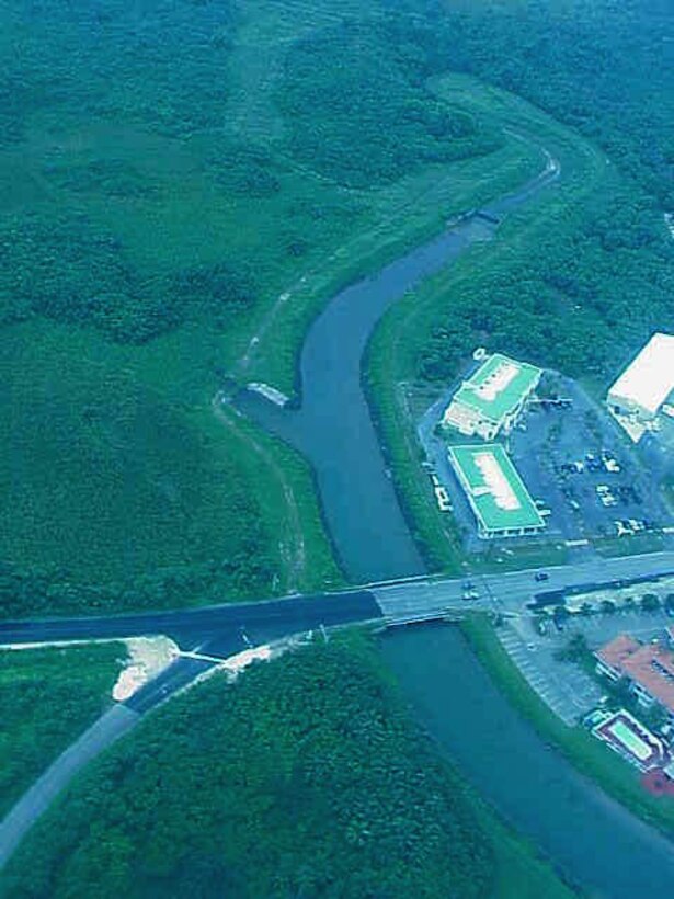Aerial photograph of the completed flood control project at Namo River in Guam. The Corps completed the project in September 1979.