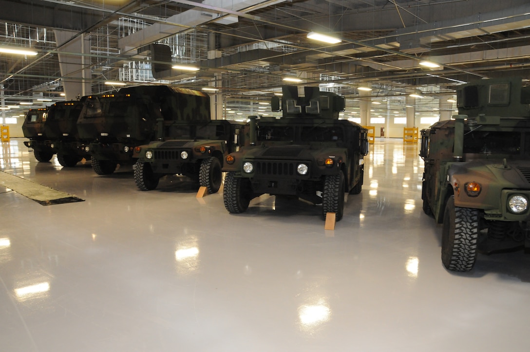 Vehicles are lined up for display during the ribbon cutting ceremony for the new humidity controlled warehouse at Camp Carroll Feb. 10.  The new facility built by the U.S. Army Corps of Engineers, Far East District will be able to house 750 vehicles at full capacity.
