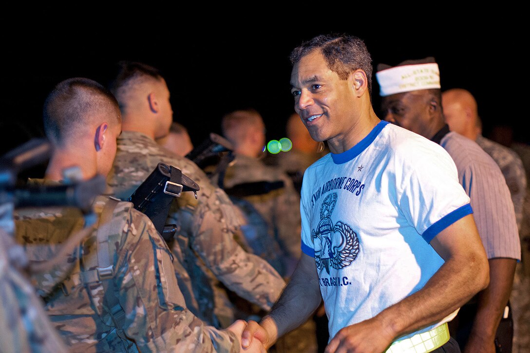 Army Brig. Gen. Michael Garrett, right, thanks deploying soldiers for their service in the early morning on Pope Army Air Field, Fort Bragg, N.C., March 21, 2012. Garrett is chief of staff of the XVIII Airborne Corps.