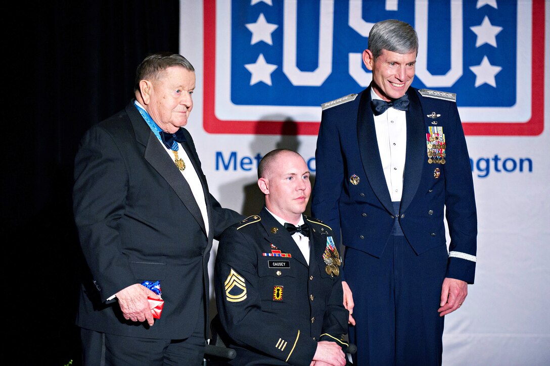 Medal of Honor recipient (ret.) Air Force Lt. Col. Joe M. Jackson, Army Sgt. 1st Class Aaron Causey and Air Force Chief of Staff Gen. Norton A. Schwartz stand together during the USO of Metropolitan Washington 30th Annual Awards Dinner in Arlington, Va., March 22, 2012. Causey served in the Air Force as an explosive ordinance disposal technician and later joined the U.S. Army. He is a combat veteran and a wounded warrior.