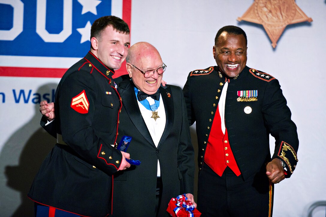 From left to right; Marine Corps Cpl. Joseph Woodke, Medal of Honor recipient Hershel "Woody" Williams and Marine Corps Director of Staff Lt. Gen. Willie J. Williams stand together during the USO of Metropolitan Washington 30th Annual Awards Dinner in Arlington, Va., March 22, 2012. Woodke is a combat veteran and a wounded warrior.