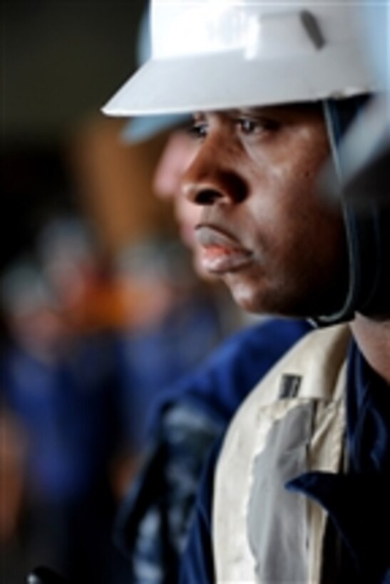 Chief Petty Officer Sorrells Claiborne supervises an underway replenishment aboard the aircraft carrier USS Carl Vinson (CVN 70) in the Arabian Sea on March 22, 2012.  The Carl Vinson and Carrier Air Wing 17 are deployed to the U.S. 5th Fleet area of responsibility.  