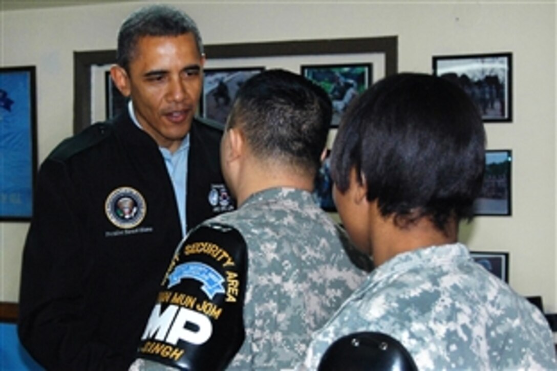 U.S. President Barack Obama shakes hands with U.S. Army Staff Sgt. Naran Singh at the dining facility on Camp Bonifas, South Korea, March 25, 2012. Singh is assigned to the United Nations Command Security Battalion. Obama is in Korea to take part in the Nuclear Security Summit in Seoul. Waiting to meet Obama is U.S. Army Spc. Andrea Gillespie. Troops from the battalion and United Nations Command Military Armistice Commission met wtih Obama during his visit to the camp and demilitarized zone.