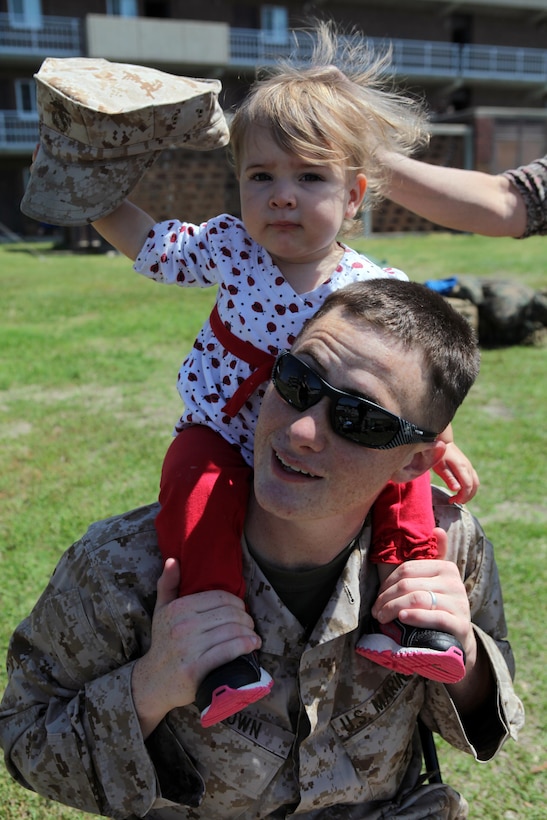 Cpl. Justin Brown, a combat engineer with Combat Logistics Battalion 24, 24th Marine Expeditionary Unit, spends time with his daughter before embarking on a scheduled eight-month deployment, March 26, 2012. The 24th MEU, partnered with the Navy’s Iwo Jima Amphibious Ready Group, is deploying to the European and Central Command theaters of operation to serve as a theater reserve and crisis response force capable of a variety of missions from full-scale combat operations to humanitarian assistance and disaster relief.