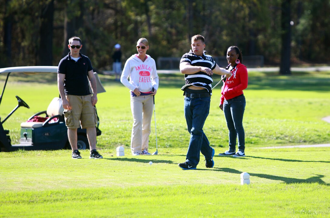 A Marine with Combat Logistics Battalion 8, 2nd Marine Logistics Group swings and misses a golf ball during a golf outing at the Paradise Point Golf Course aboard Camp Lejeune, N.C., March 27, 2012. The purpose of the day was to give the battalion’s Marines and sailors a day of rest and relaxation. Though many of the participants had no experience golfing, everyone approached the day with an open mind. (U.S. Marine Corps photo by Pfc. Franklin E. Mercado)