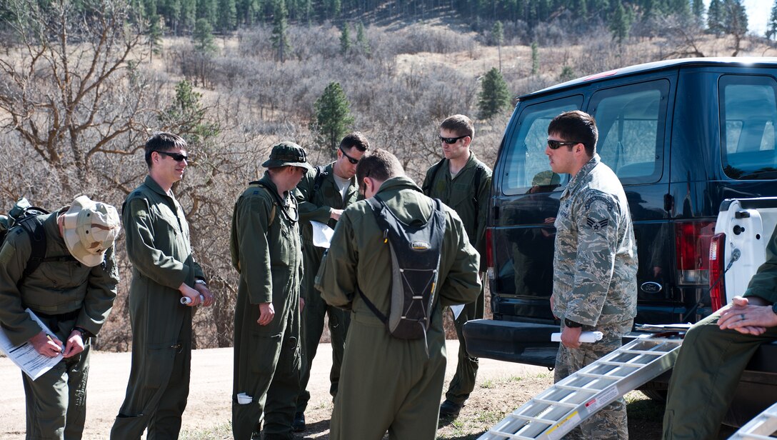 Senior Airman Zachary Yoakam, 28th Operations Support Squadron Survival Evasion Rescue Escape specialist, gives a safety briefing to participants of combat survival training at the Sturgis Training Compound, Sturgis, S.D., March 22, 2012. Yoakam ensures that the participants understand the training rules and guidelines for the survival exercise. (U.S. Air Force photo by Airman 1st Class Alystria Maurer/Released)