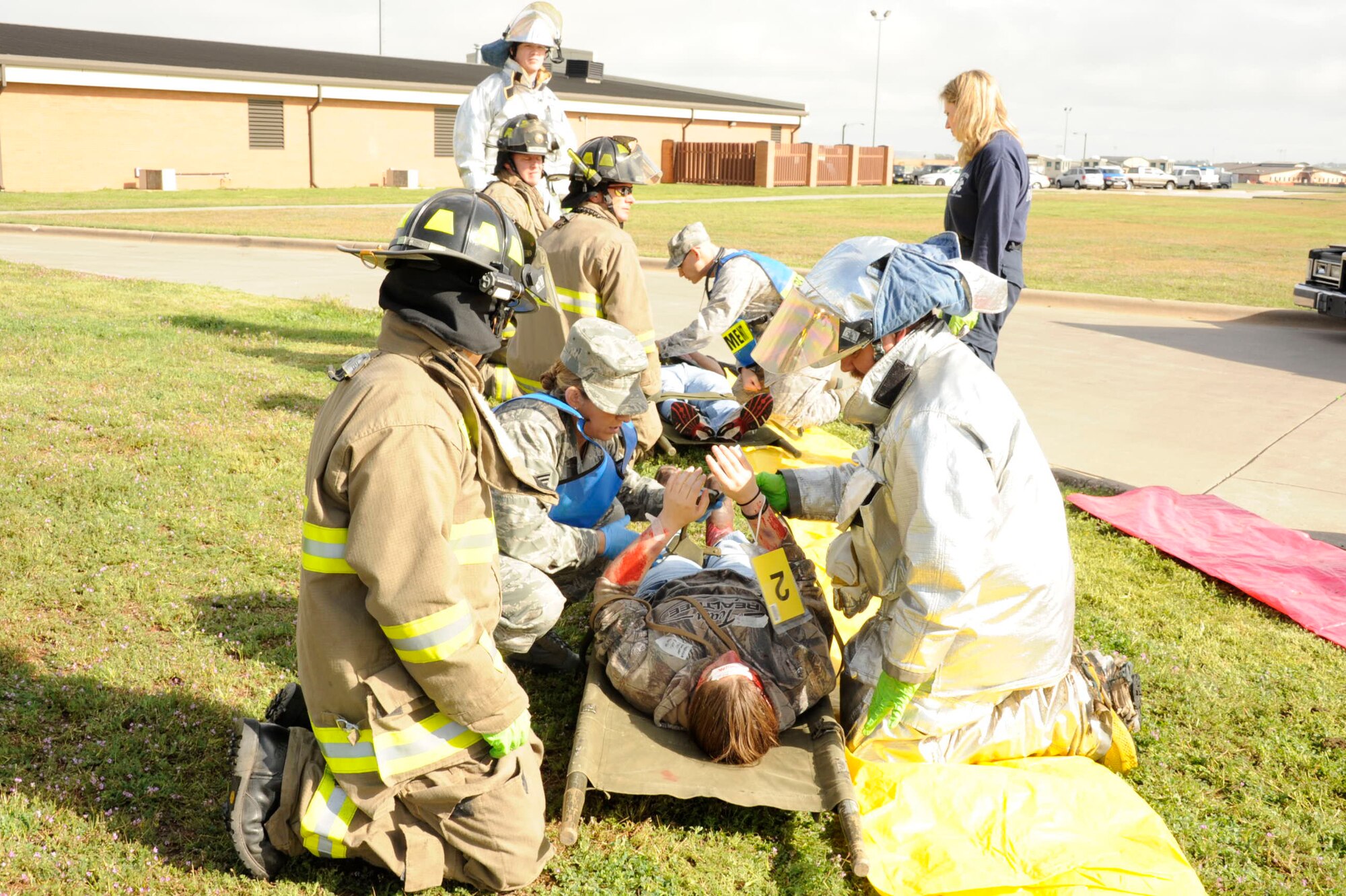 First responders practice treating casualties at the scene of a simulated tornado during a Severe Weather Response Exercise March 21 at Sheppard. The exercise in conjunction with preparation tips provided by the Sheppard Emergency Management Office ensure base personnel are prepared to respond to a tornado. (U.S. Air Force photo/Danny Webb)