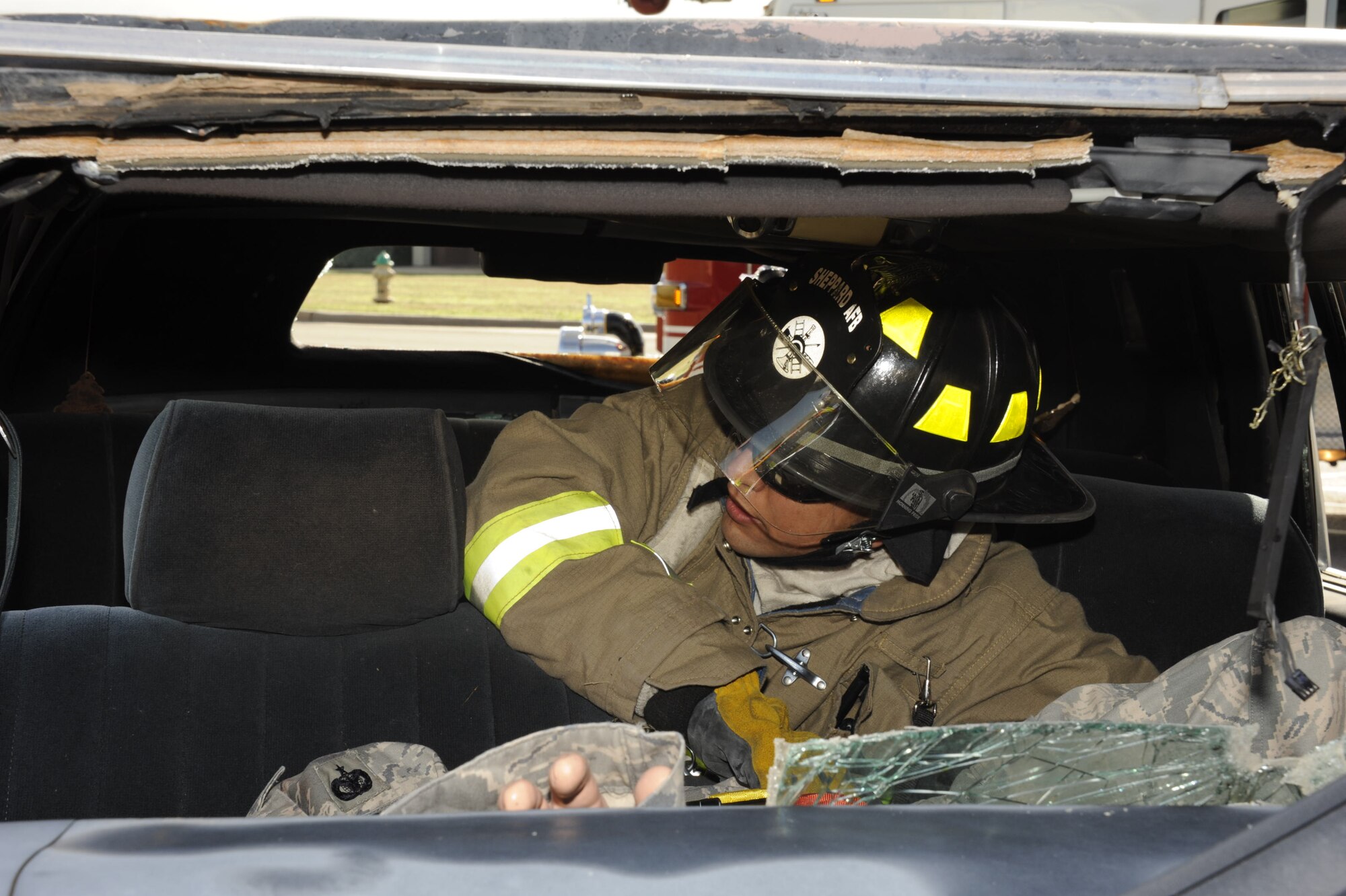A Sheppard firefighter stabilizes and moves a mannequin simulating a tornado victim during a Severe Weather Response Exercise March 21. The Sheppard Emergency Management Office encourages all base personnel to have a thorough plan in case of a tornado. (U.S. Air Force photo/Danny Webb)