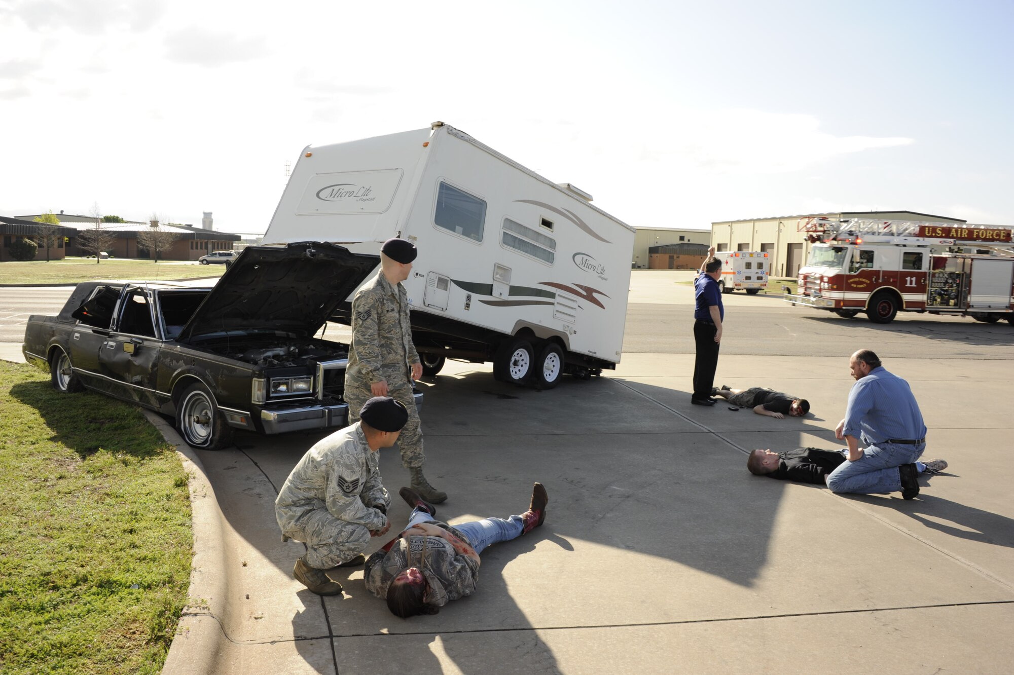 Sheppard Air Force Base personnel take action in the aftermath of a simulated tornado during a Severe Weather Response Exercise March 21. To prepare for tornado season, the Sheppard Emergency Management Office provides important weather information to base personnel. (U.S. Air Force photo/Danny Webb)