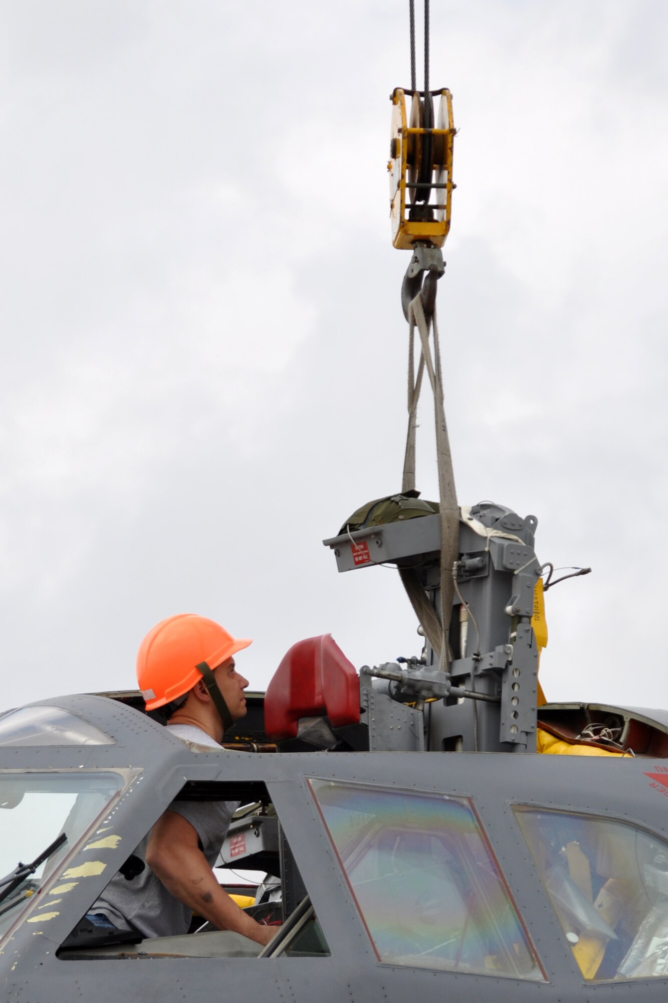 Tech. Sgt. Richard Harick, an egress technician assigned to the 307th Maintenance Group, guides an ejection seat into a B-52 Stratofortress at Barksdale Air Force Base, La., March 19, 2012. Maintenance personnel were re-installing the ejection seats into the jet after other components had been replaced. (U.S. Air force photo by Master Sgt. Jeff Walston/Released)