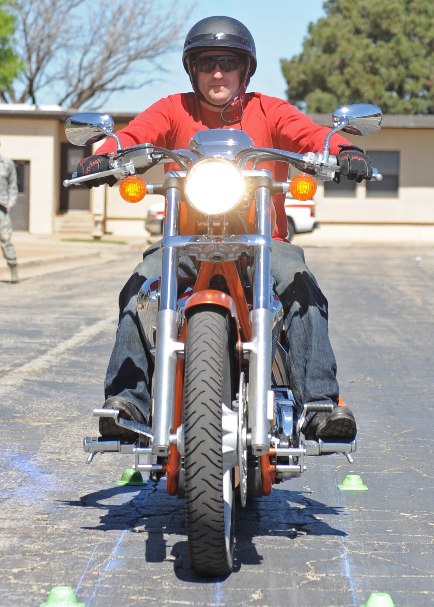 U.S. Air Force Staff Sgt. Daniel McBay, 7th Civil Engineer Squadron, rides his motorcycle down the slow-ride competition course March 23, 2012, at Dyess Air Force Base, Texas. The bike safety rally showcased airmen’s bikes and highlighted the importance of properly using gear and equipment. (U.S. Air Force photo by Airman 1st Class Peter Thompson/ Released)