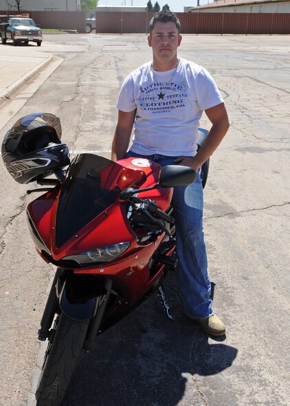 Airman 1st Class Michael Forciber, 7th Civil Engineer Squadron, sits on his motorcycle after winning the slow-ride competition at the 7 CES Spring bike safety rally March 23, 2012, at Dyess Air Force Base, Texas. The bike safety rally showcased airmen’s bikes and highlighted the importance of properly using gear and equipment. (U.S. Air Force photo by Airman 1st Class Peter Thompson/ Released)