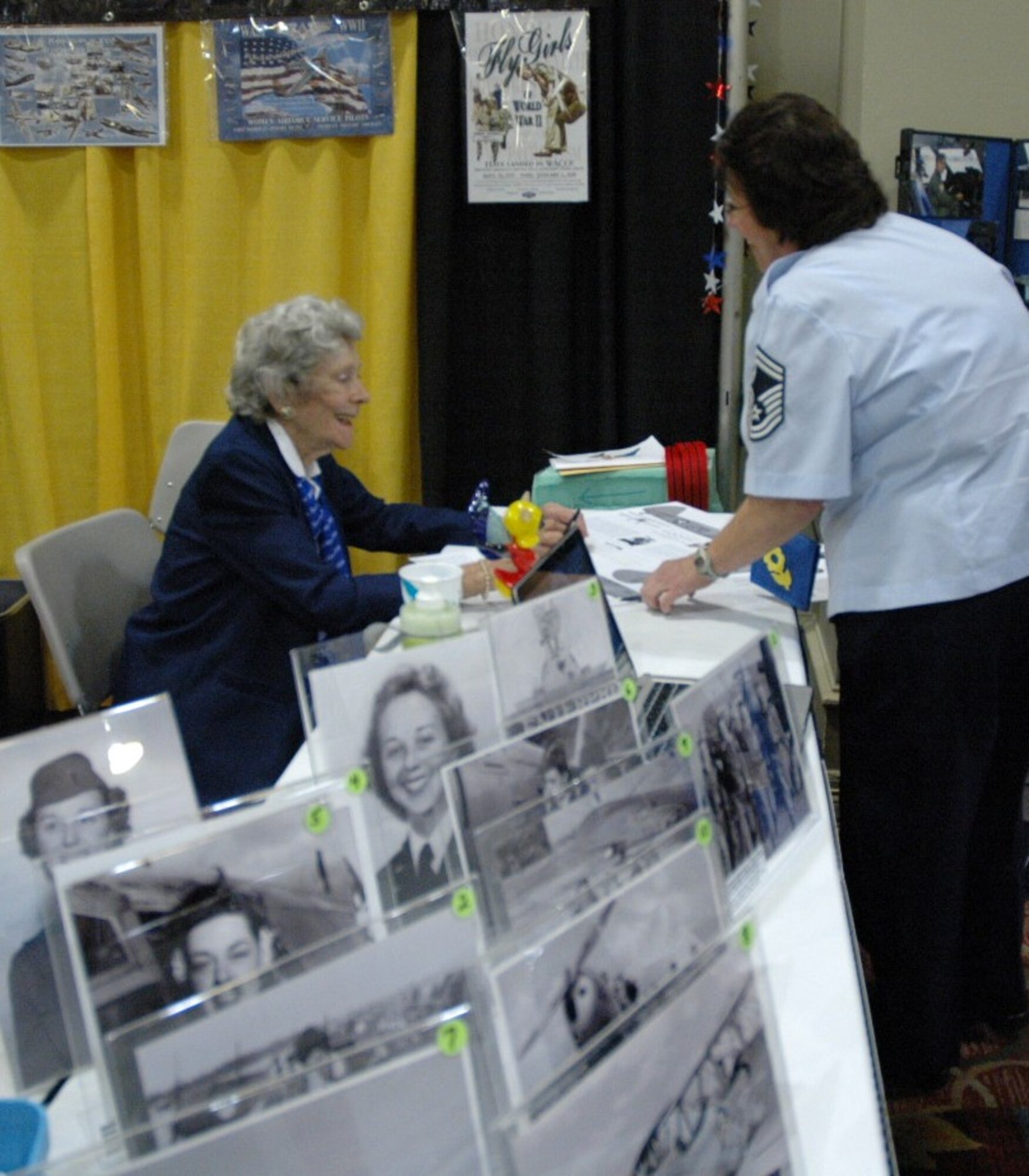 WWII Women Airforce Service Pilot, Bernice "Bee" Falk Haydu, reminisces about her time in the Air Force with Senior Master Sgt. Michele Juliano, a 940th Wing Reservist from Beale Air Force Base, Calif., at the 2012 International Women in Aviation Conference in Dallas, Texas, March 8-10. Haydu was inducted into the WIA International Pioneer Hall of Fame 2012 during a special ceremony at the culmination of the annual event. (U.S. Air Force photo/Dana Lineback)