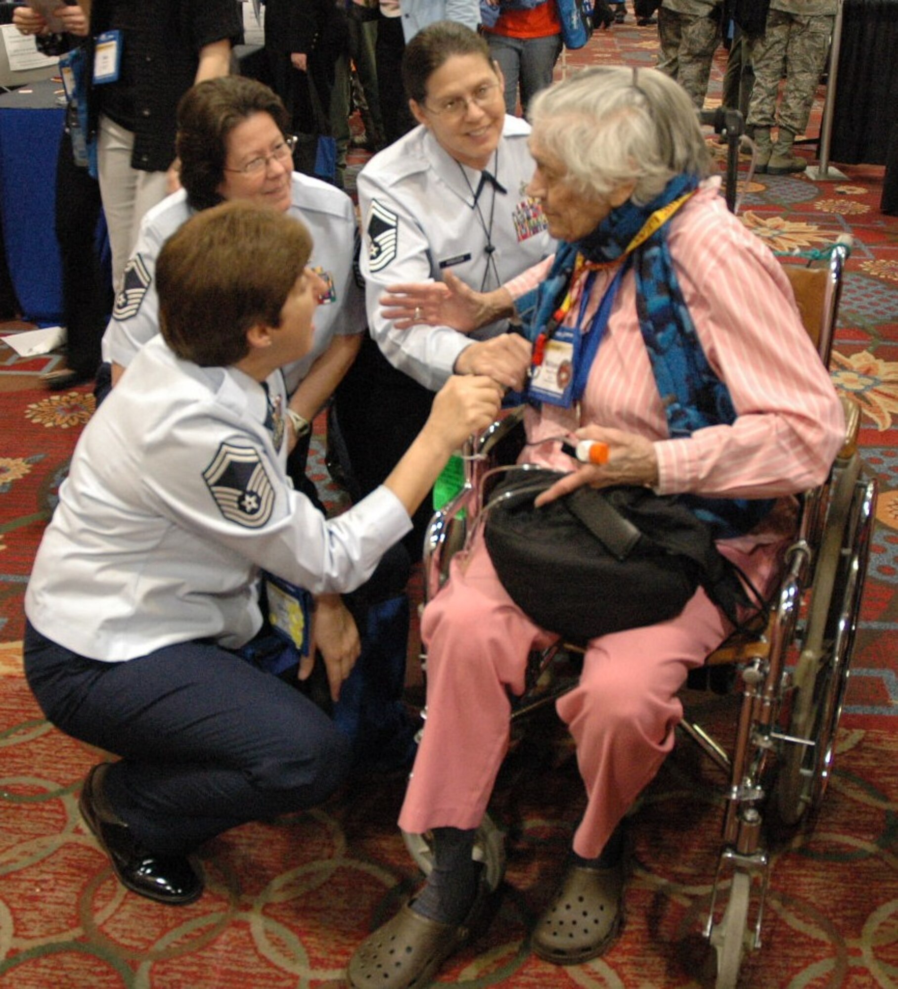 940th Wing senior master sergeants Cheryl Orr (left), Michele Juliano (center) and Nancy Hinojosa (right) renew their acquaintance with WWII Women Airforce Service Pilot, Millicent Peterson Young, at the 2012 International Women in Aviation Conference in Dallas, Texas, March 8-10. The annual conference brought together aviation enthusiasts from across the globe, offering participants an opportunity to network with legends in aviation history, as well as leaders in today's aviation industry. (U.S. Air Force photo/Dana Lineback) 