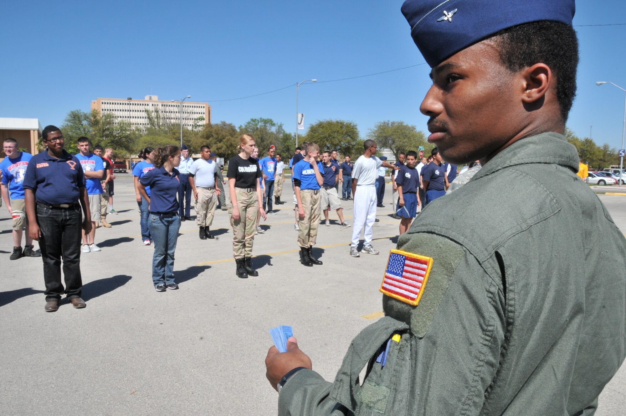 SAN ANGELO, Texas – Cadet Fourth Class, Mario Allen, Air Force Reserve Officers’ Training Corps Detachment 847 member, collects raffle tickets from JROTC members who wished to participate in a round of knock-out during a JROTC drill competition meet at Angelo State University March 24. Knock-out tests a member on coordination and execution of command. (U.S. Air Force photo/ Staff Sgt. Tong Duong)