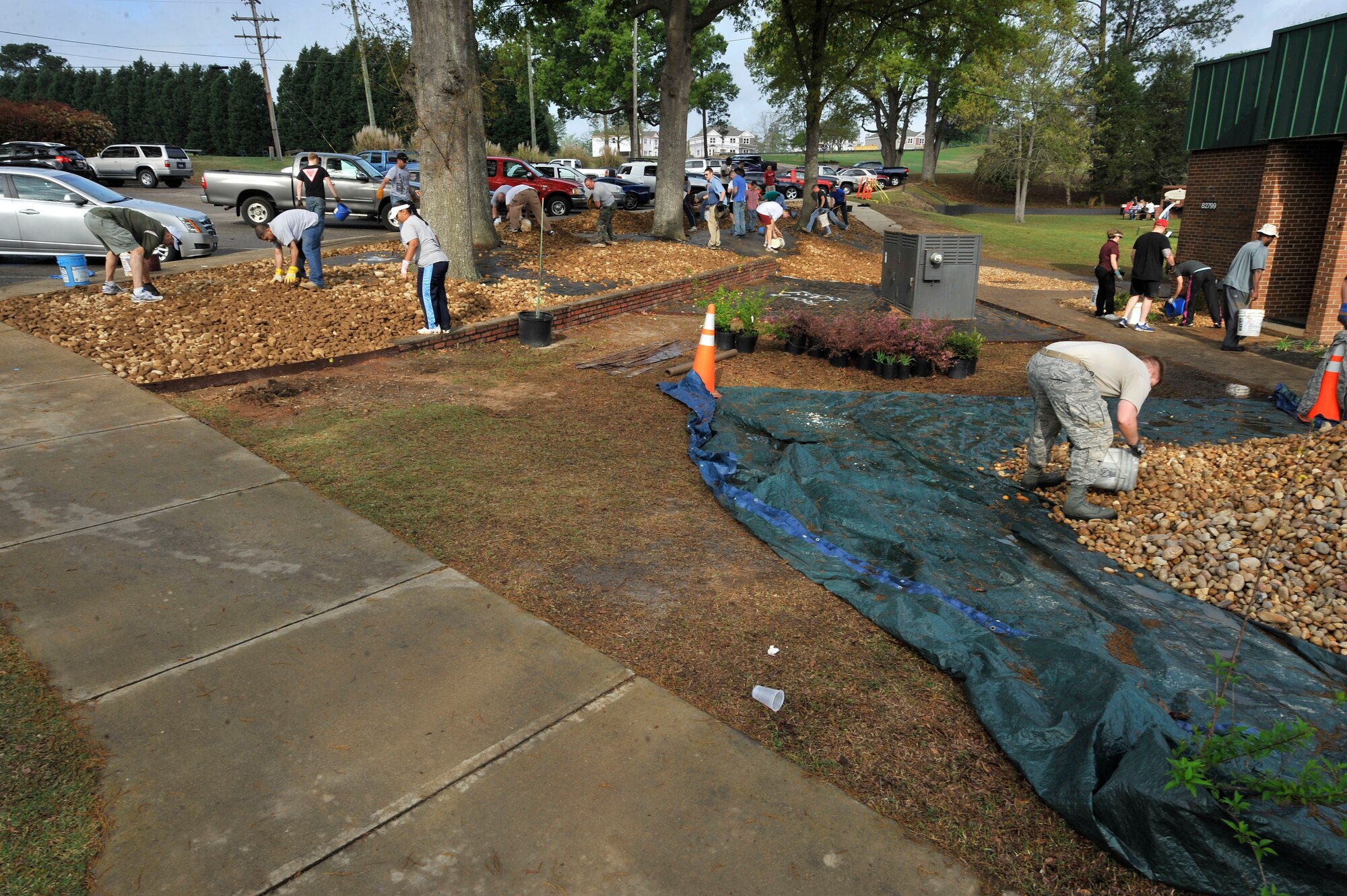 U.S. Air Force Airmen make landscaping restorations at Carolina Lakes Golf Course at Shaw Air Force Base, S.C., March 24, 2012.  These Airmen helped to lay rocks as well as pick up natural debri. (U.S. Air Force photo by Airman Nicole Sikorski/Released)