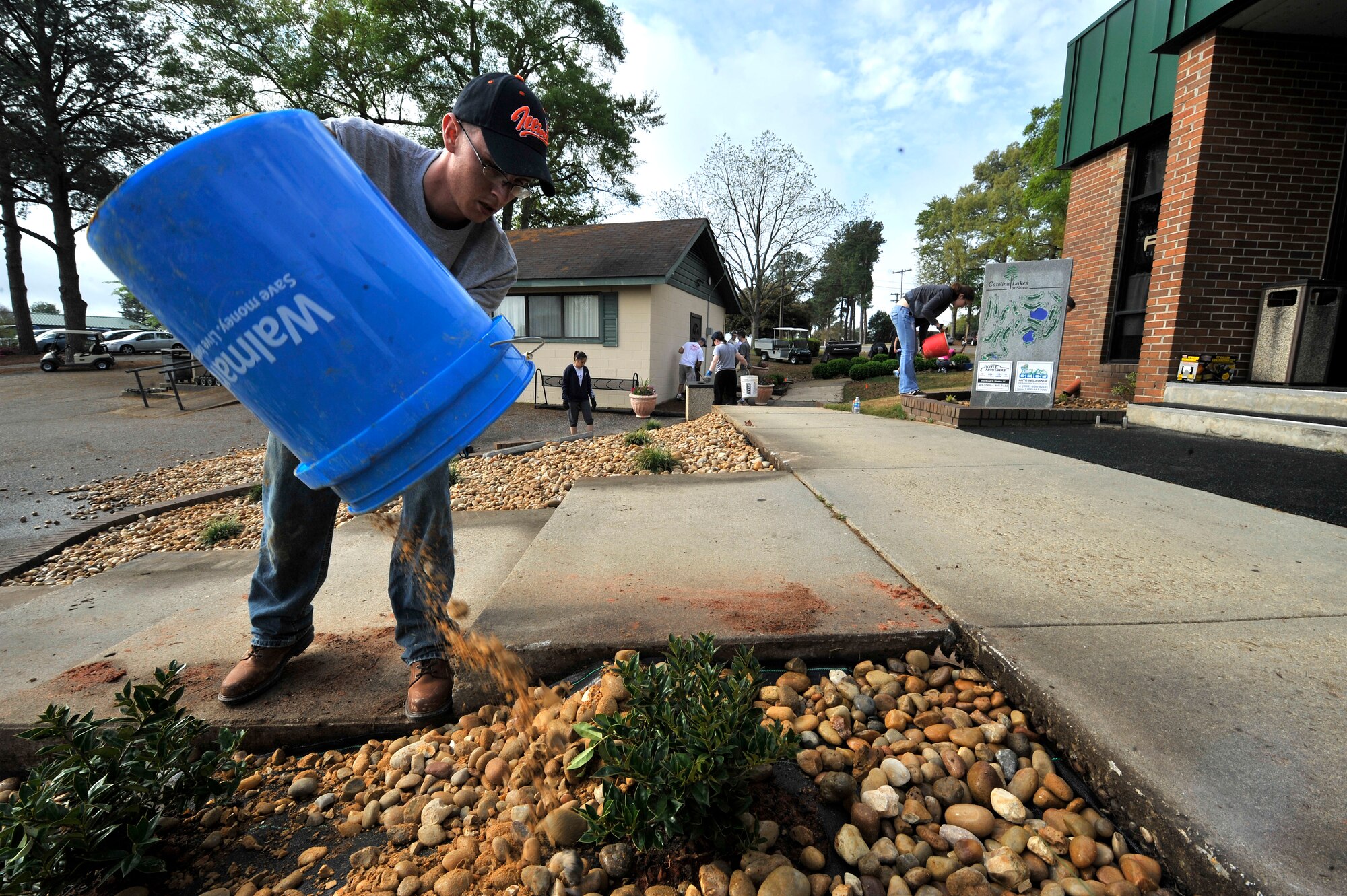 U.S. Air Force Staff Sgt. Matthew Jones, 20th Security Force Squadron, Desk Sergeant lays rocks at Carolina Lakes Golf Course at Shaw Air Force Base, S.C., March 24, 2012. Jones along with other Airmen helped to restore the landscaping at Carolina Lakes Golf course.(U.S. Air Force photo by Airman Nicole Sikorski/Released)


