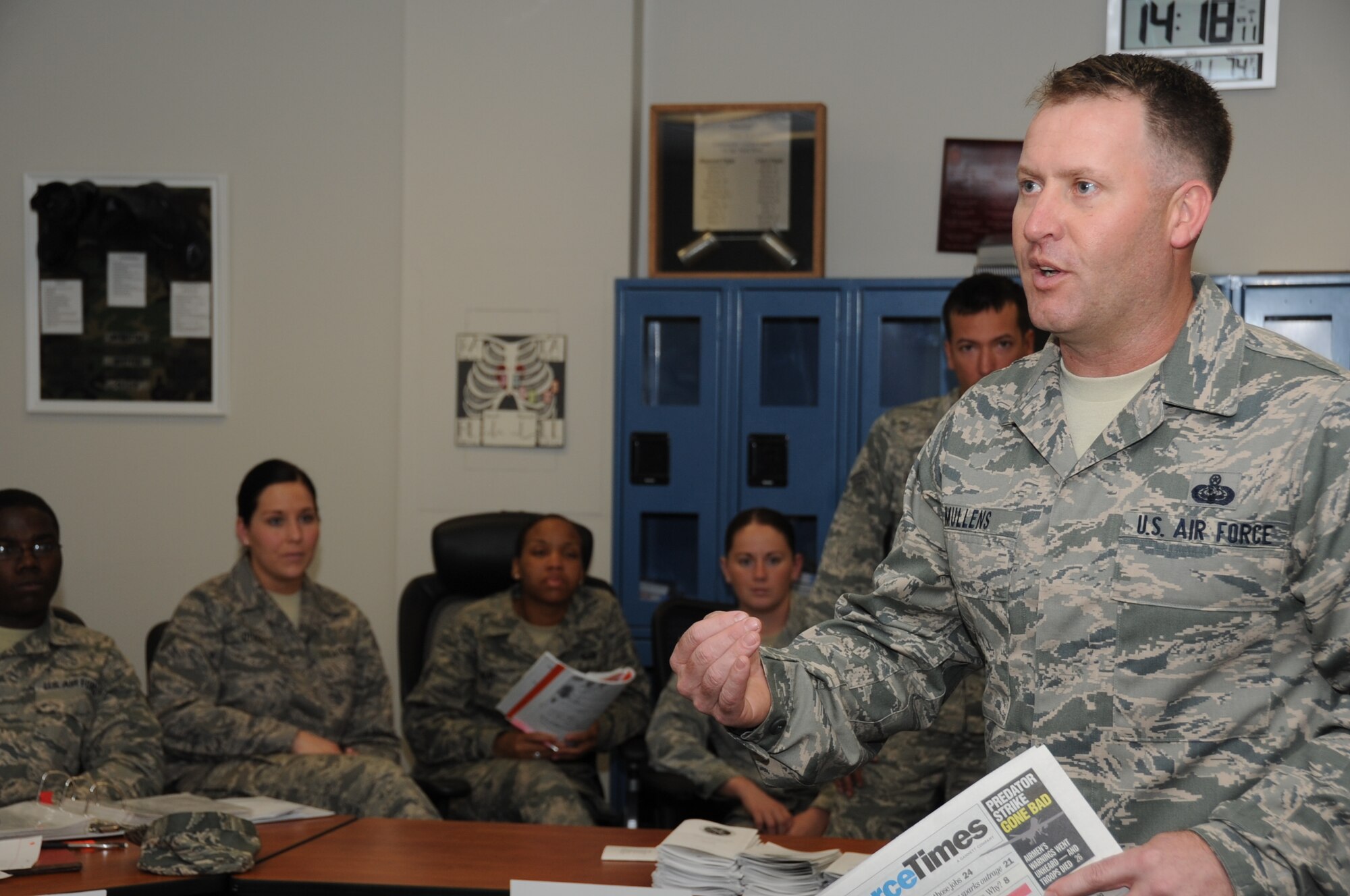 Senior Master Sgt. Steven Mullens, 81st Force Support Squadron career assistance advisor, discusses benefits available to members with Airman Leadership students March 22, 2012, at the ALS building at Keesler Air Force Base, Miss.  Mullens said that he relates his duties to a triangle; one side is benefits and compensation, one side is career progression and the last side is professional development. All the required duties of a CAA fall into at least one segment of that triangle.  (U.S. Air Force photo by Kemberly Groue)