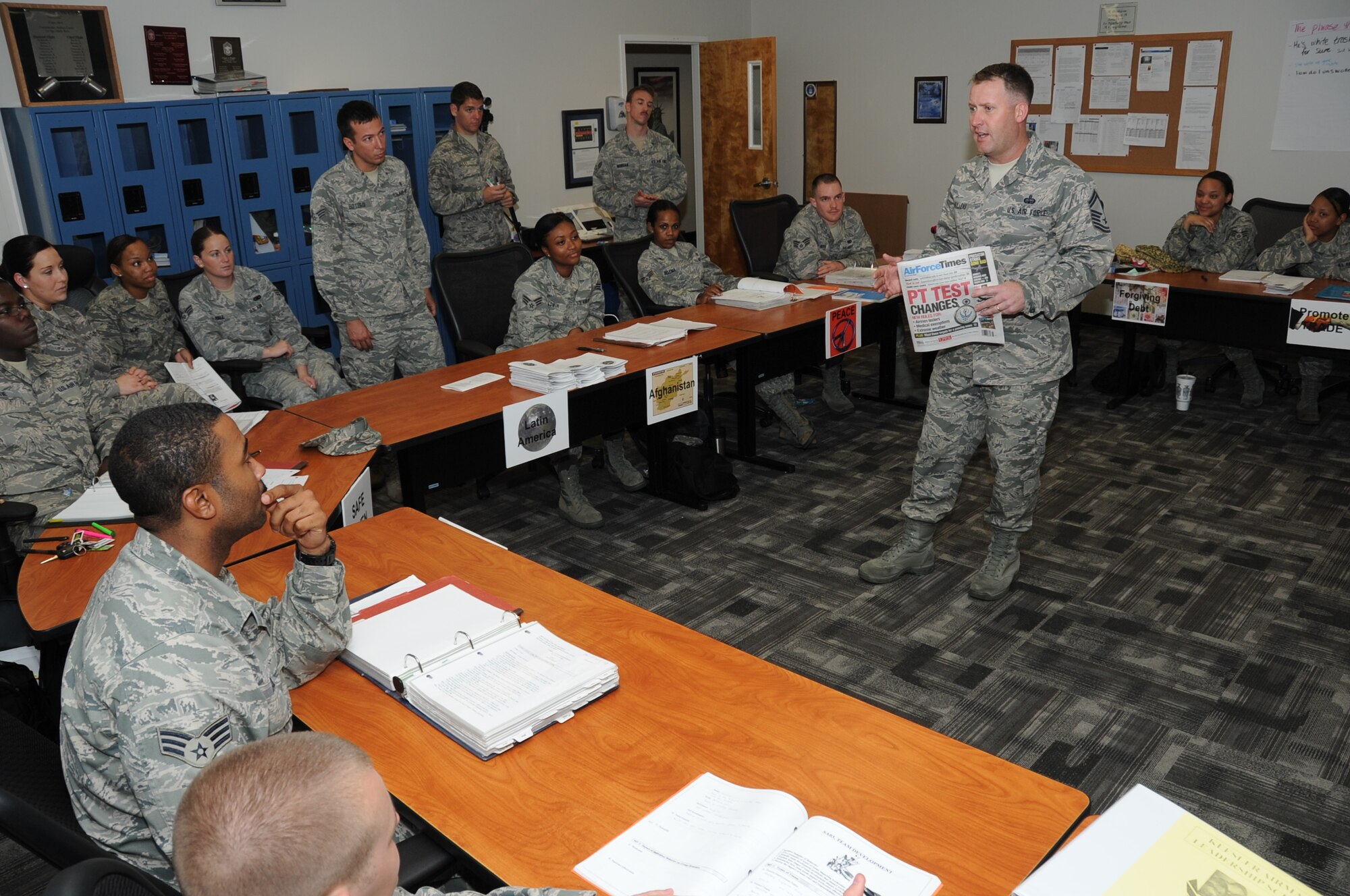 Senior Master Sgt. Steven Mullens, 81st Force Support Squadron career assistance advisor, discusses benefits available to members with Airman Leadership students March 22, 2012, at the ALS building at Keesler Air Force Base, Miss.  Mullens said that he relates his duties to a triangle; one side is benefits and compensation, one side is career progression and the last side is professional development. All the required duties of a CAA fall into at least one segment of that triangle.  (U.S. Air Force photo by Kemberly Groue)