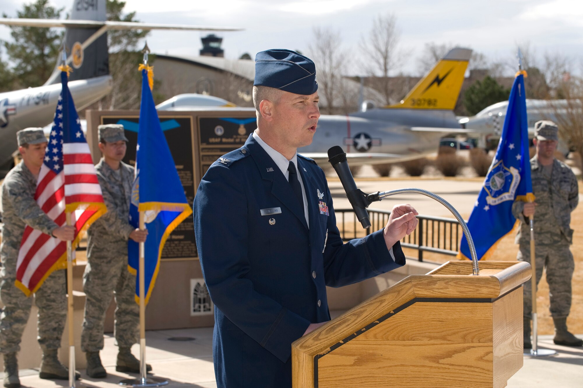 Col. Jeffrey Flewelling, 21st Space Wing vice commander, makes remarks at the Peterson Medal of Honor memorial. Chief Master Sgt. Richard Etchberger, who was killed in the country of Laos during the Vietnam war, posthumously received the Medal of Honor in 2010, and his name was added to the Peterson memorial March 22. (U.S. Air Force photo/Craig Denton)