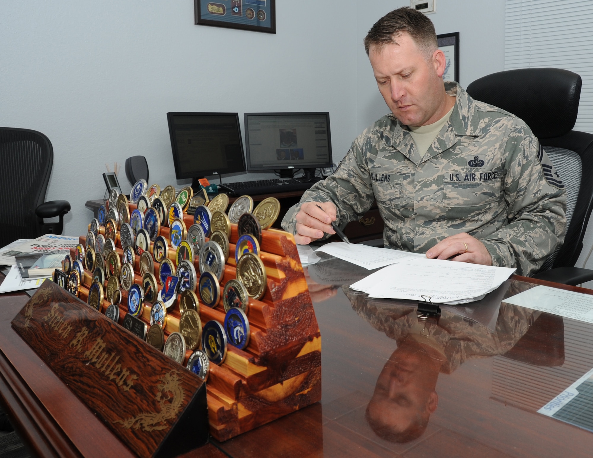 Senior Master Sgt. Steven Mullens, 81st Force Support Squadron career assistance advisor, reviews first term airman center critiques March 23, 2012, from the most recent FTAC seminar at Keesler Air Force Base, Miss.  Career assistance advisors are a special duty position in place to help supervisors and the base populace to understand the benefits and opportunities available to Air Force members.  Mullens is one of only 84 CAAs in the Air Force and has volunteered for the duty twice in his career.  (U.S. Air Force photo by Kemberly Groue)
