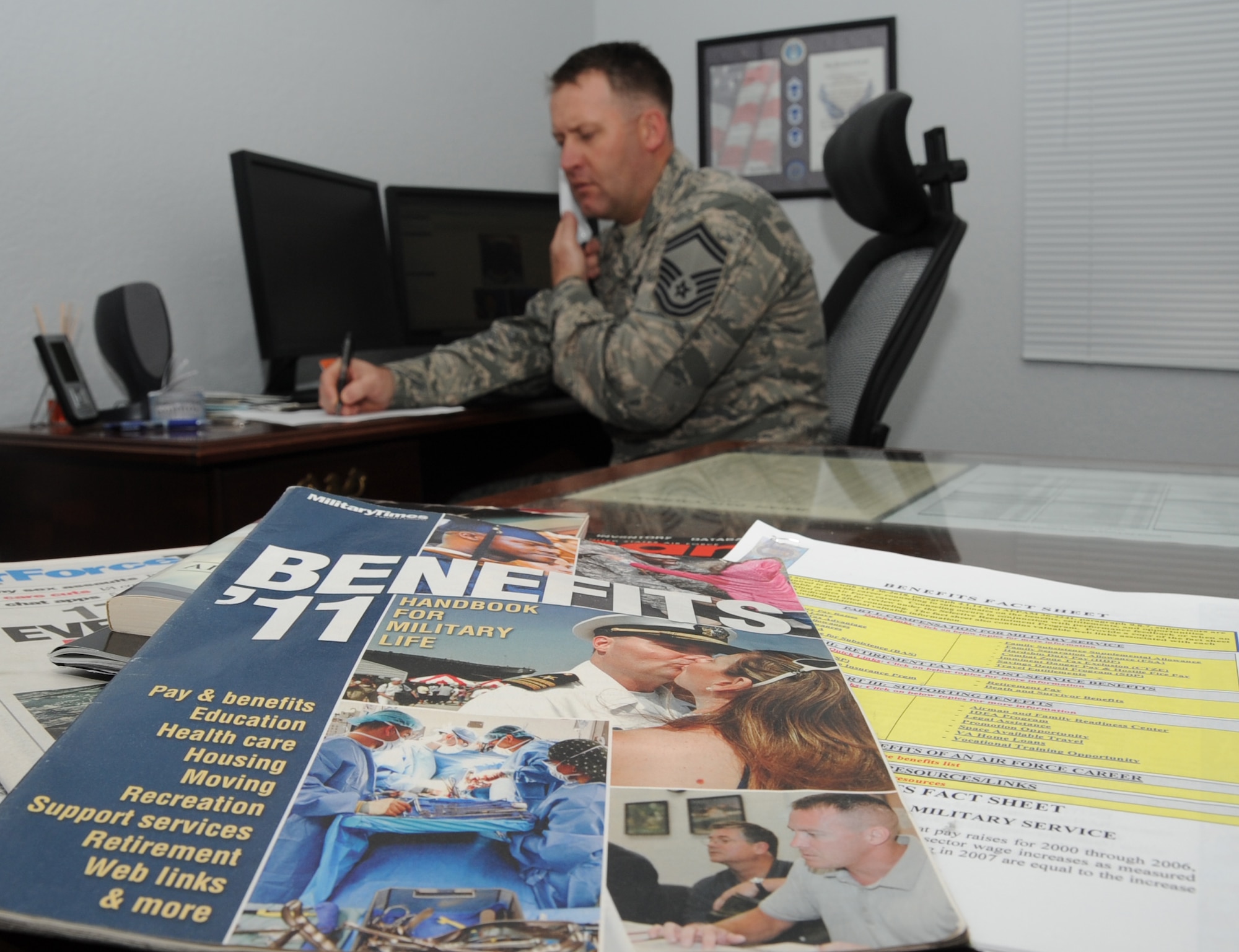 Senior Master Sgt. Steven Mullens, 81st Force Support Squadron career assistance advisor, checks on the status of a member’s retraining package and assignment from the Total Force Service Center while working in his office March 23, 2012, at Keesler Air Force Base, Miss.  Mullens said that he relates his duties to a triangle; one side is benefits and compensation, one side is career progression and the last side is professional development. All the required duties of a CAA fall into at least one segment of that triangle.  (U.S. Air Force photo by Kemberly Groue)