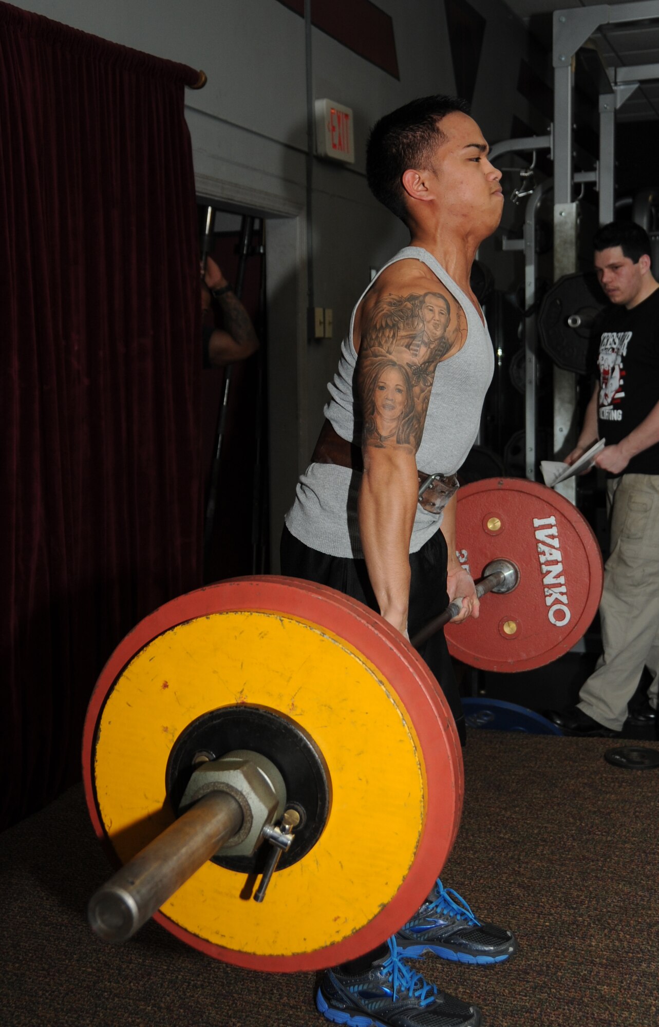 Airman First Class Aerone Baladad, 81st Diagnostic and Therapeutics Squadron, dead lifts 352.7 pounds during the muscle mania competition at the triangle fitness center, Keesler Air Force Base, Miss.  Baladad placed third overall in the open raw division.  (U.S. Air Force photo by Kemberly Groue)