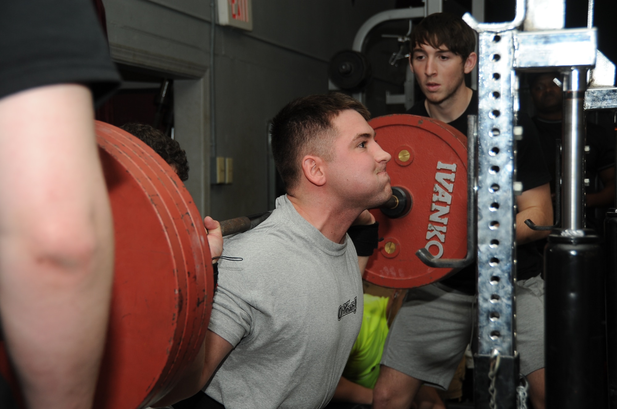 Senior Airman Derek Sanford, 81st Aerospace Medicine Squadron, squats 501.5 pounds to complete his third and final round of squats during the muscle mania competition March 24, 2012, at the Triangle Fitness Center, Keesler Air Force Base, Miss.  Sanford placed second overall in the open raw division.  (U.S. Air Force photo by Kemberly Groue)