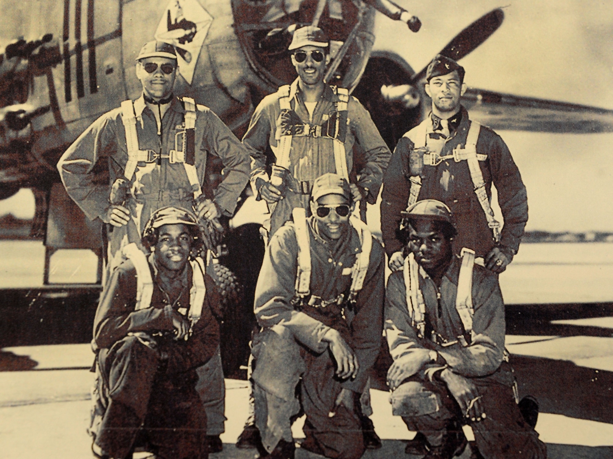 Tuskegee Airman Edward Gibson poses (back row, right) in front of a B-25 bomber with his crew during World War II. Gibson served in the Army Air Corps as a bombardier-navigator and logged 2,300 flight hours. (Courtesy Photo)