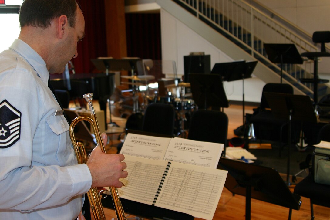 Master Sergeant Rich Sigler, music director of the USAF Airmen of Note, studies a music score before the band's rehearsal