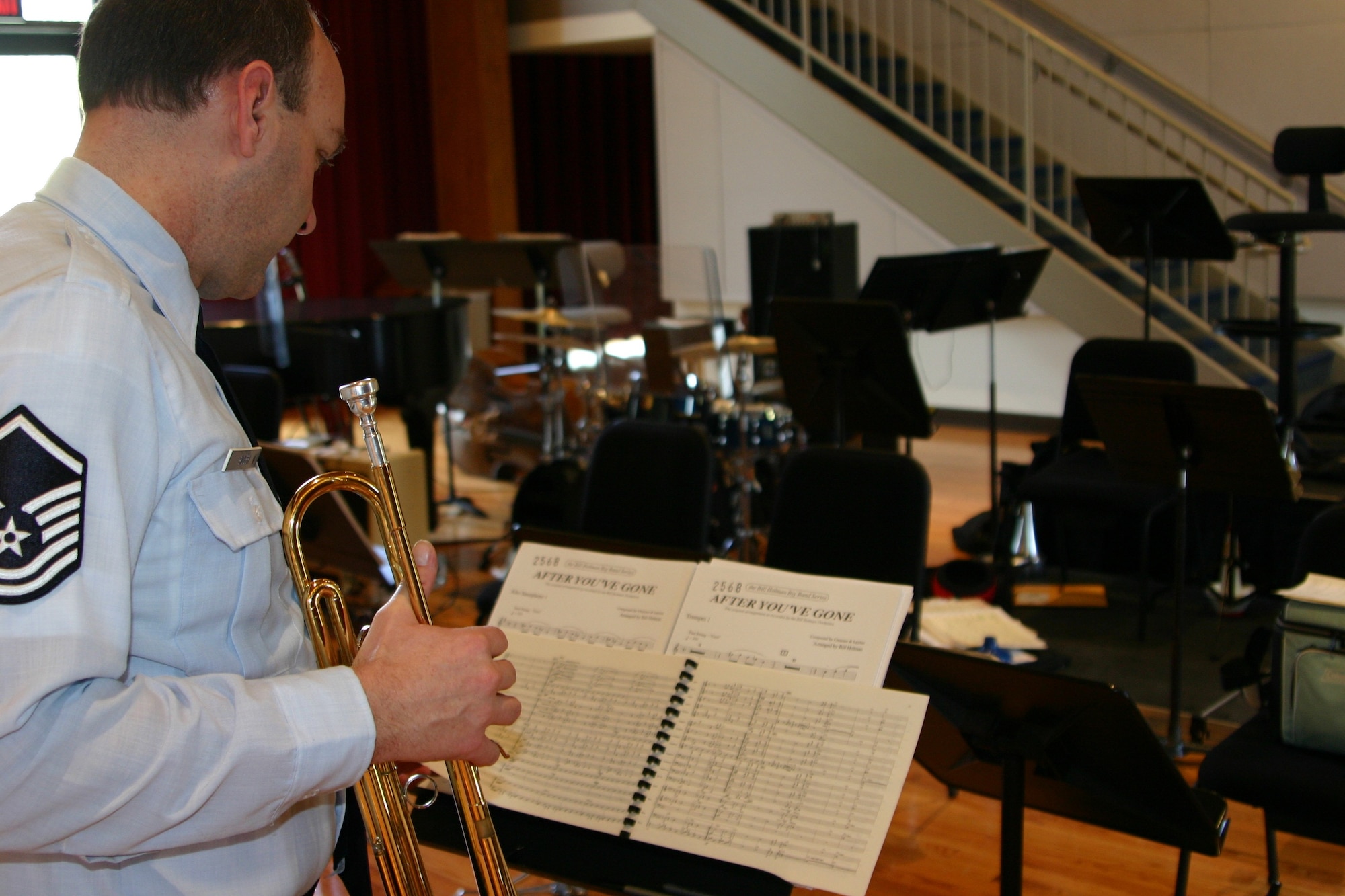 Master Sergeant Rich Sigler, music director of the USAF Airmen of Note, studies a music score before the band's rehearsal