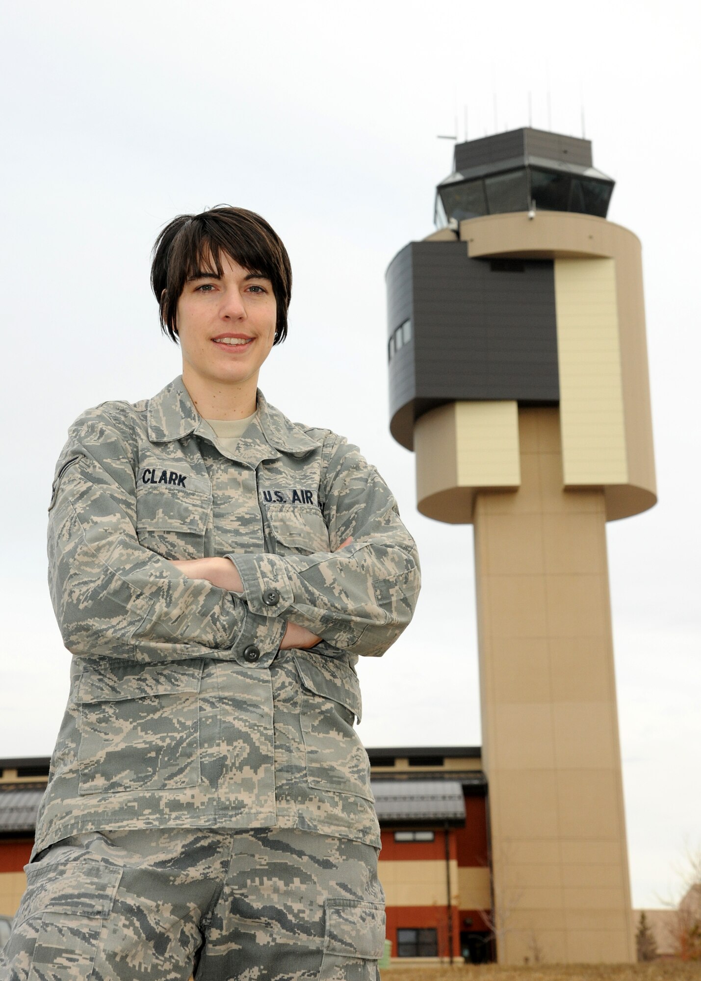 Airman 1st Class Andrea Clark, an air traffic controller with the 319th Operations Support Squadron, poses for a photo near the ATC tower March 15, 2012, on Grand Forks Air Force Base, N.D. Clark was named as the the Warrior of the Week beginning March 28. (U.S. Air Force photo/Airman 1st Class Ashley N. Taylor)