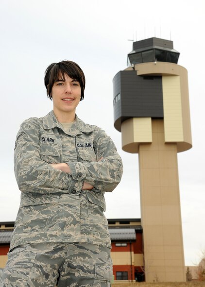 Airman 1st Class Andrea Clark, an air traffic controller with the 319th Operations Support Squadron, poses for a photo near the ATC tower March 15, 2012, on Grand Forks Air Force Base, N.D. Clark was named as the Warrior of the Week beginning March 28. (U.S. Air Force photo/Airman 1st Class Ashley N. Taylor)