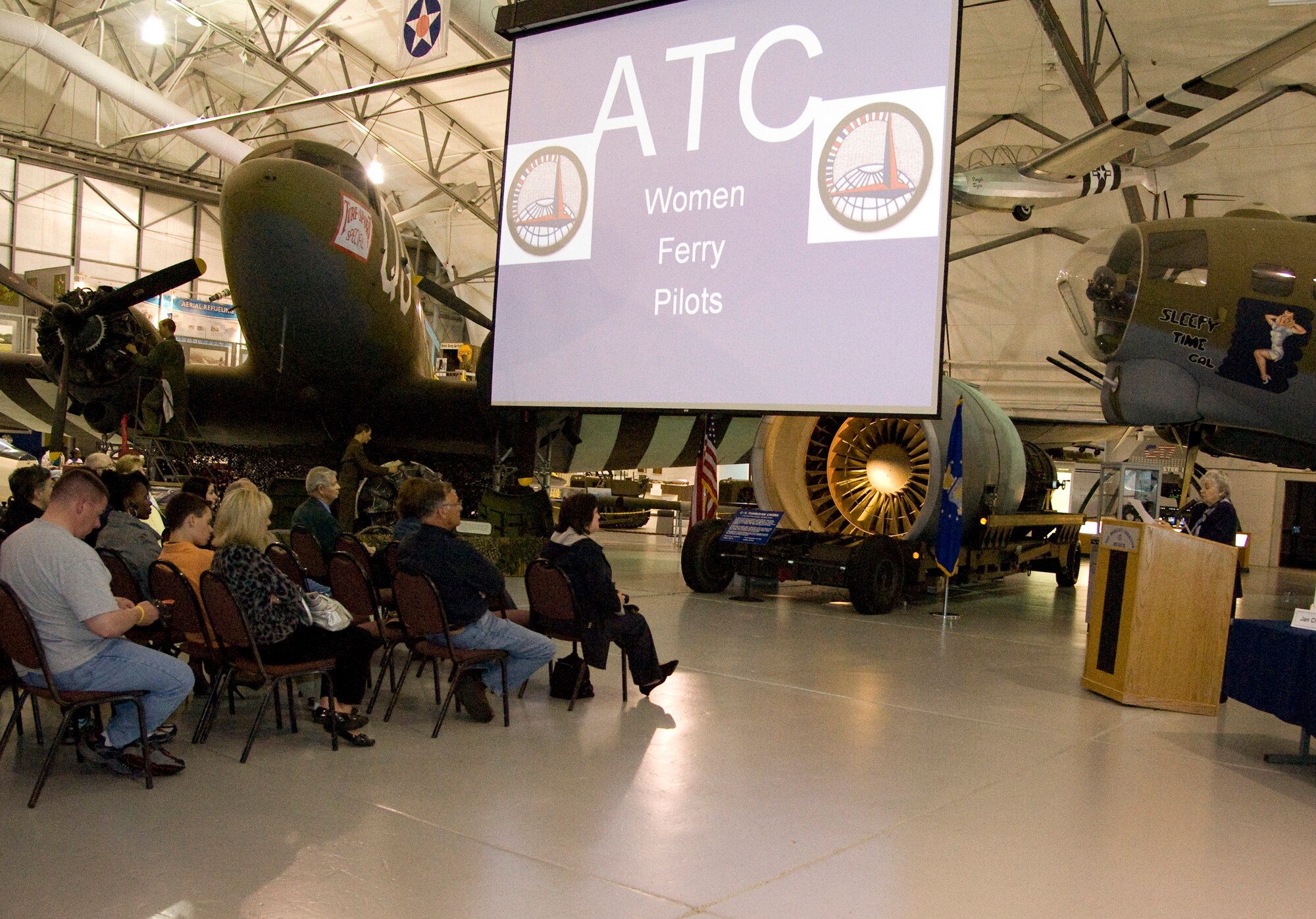 Jan Churchill, author of "From Delaware to Everywhere," speaks at a book presentation highlighting the book's focus, the Women's Auxiliary Flying Squadron, March 25, 2012, at the Air Mobility Command Museum, Del. Churchill was hosted by the Wilmington University Library and the Dover Air Force Base, Del., Library, and spoke about her personal experiences during her research for her book while relating the history of the WAFS and the women who comprised it. (U.S. Air Force photo by Senior Airman Matthew Hubby)