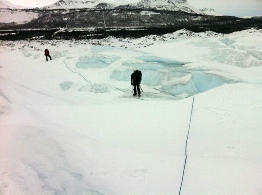 Staff Sgt. Darrell Williams, Air Force Reserve pararescueman (PJ), 920th Rescue Wing, Patrick Air Force Base, Fla., climbs frigid Alaskan glaciers as part of his winter mountain training along with the Alaskan National Guard PJs. Williams is imbedded temporarily with the ANG, and is serving a three-week tour in Alaska to hone his cold weather rescue skills and augment the ANG Guardian Angel Airmen. While working with the ANG, Williams rescued an injured avalanche victim March 18, 2012. (U.S. Air Force photo/courtesy) 