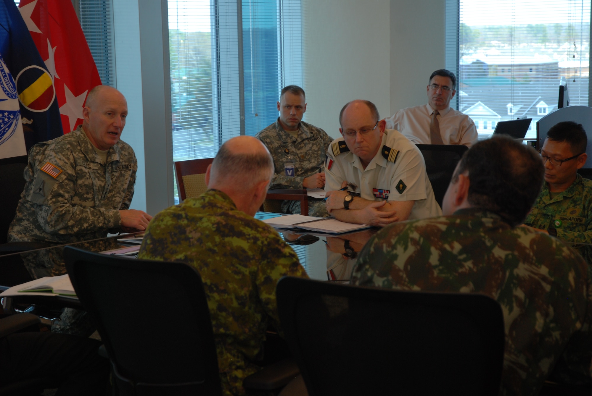 Gen. Robert W. Cone, TRADOC Commanding General, sits down with Foreign Liaison Officers during the quarterly FLO meeting held on March 15, 2012 at TRADOC Headquarters.
Members of TRADOC's Foreign Liaison Officer Program, collectively representing more than 16 countries, provided updates on their respective armies to Cone during the meeting. (Courtesy Photo)