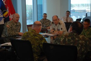 Gen. Robert W. Cone, TRADOC Commanding General, sits down with Foreign Liaison Officers during the quarterly FLO meeting held on March 15, 2012 at TRADOC Headquarters.
Members of TRADOC's Foreign Liaison Officer Program, collectively representing more than 16 countries, provided updates on their respective armies to Cone during the meeting. (Courtesy Photo)