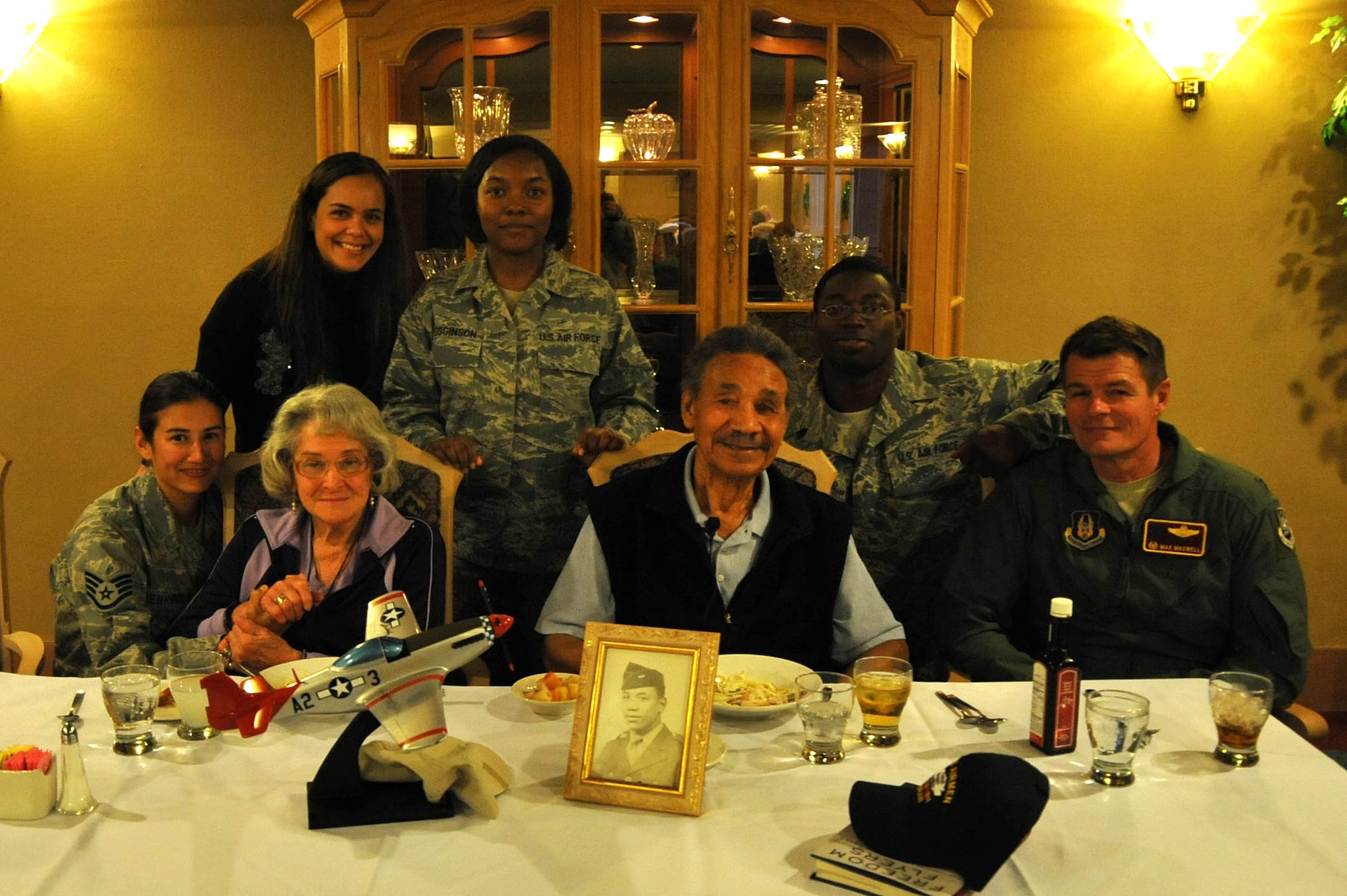 Airmen from the 943rd Rescue Group pose for a photograph with Mr. Ralph Stewart and his wife Rosalyn during a ceremony to honor his service in the U.S. Army Air Corps. Mr. Stewart was a mechanic on the B-25 and B-26 bombers as a Tuskegee Airman. (U.S. Air Force Photo/ Master Sgt. Luke Johnson)