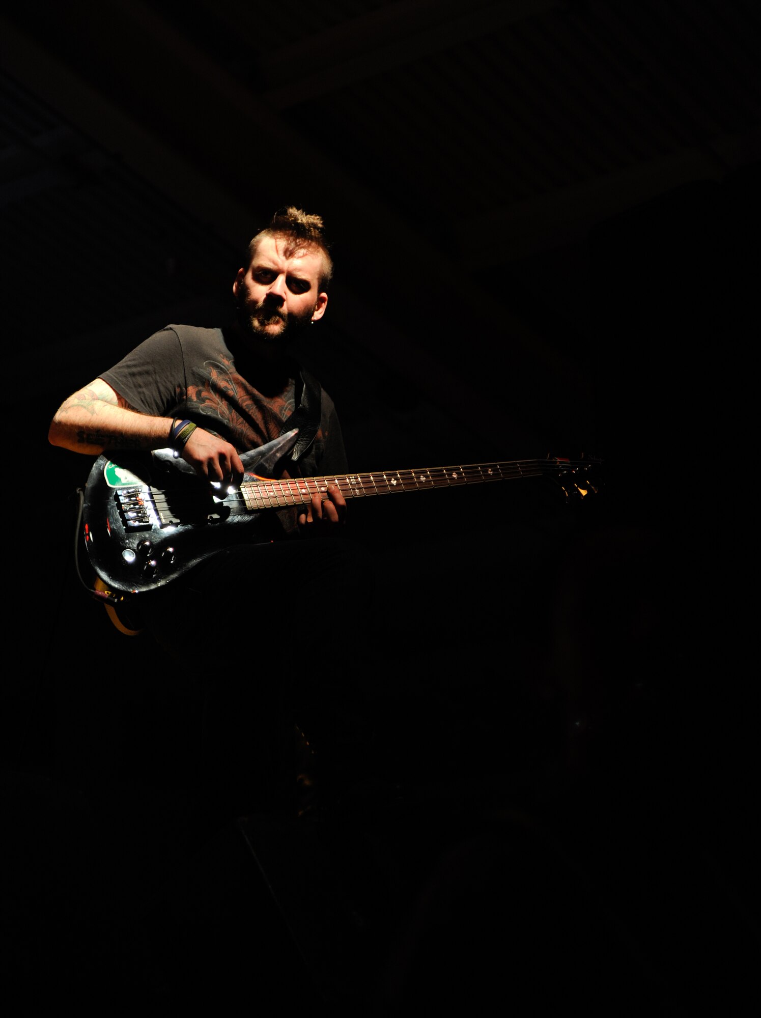 Dale Stewart, bassist for the band Seether, performs for more than 870 Aviano Team members March 23, 2012, at Aviano Air Base, Italy. The hard-rock band visited Aviano as part of a USO tour through Italy and Turkey (U.S. Air Force photo/Staff Sgt. Justin Weaver)