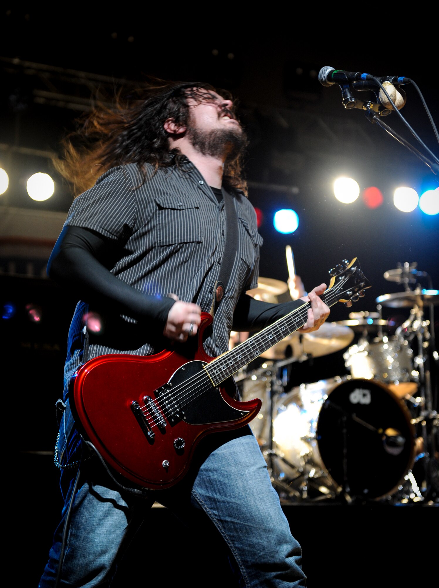 Shaun Morgan, lead singer for the band Seether, plays for more than 870 people March 23, 2012 at Aviano Air Base, Italy, The three-person rock band from South Africa visited Aviano during their USO tour through Italy and Turkey. (U.S. Air Force photo/Staff Sgt. Justin Weaver)
