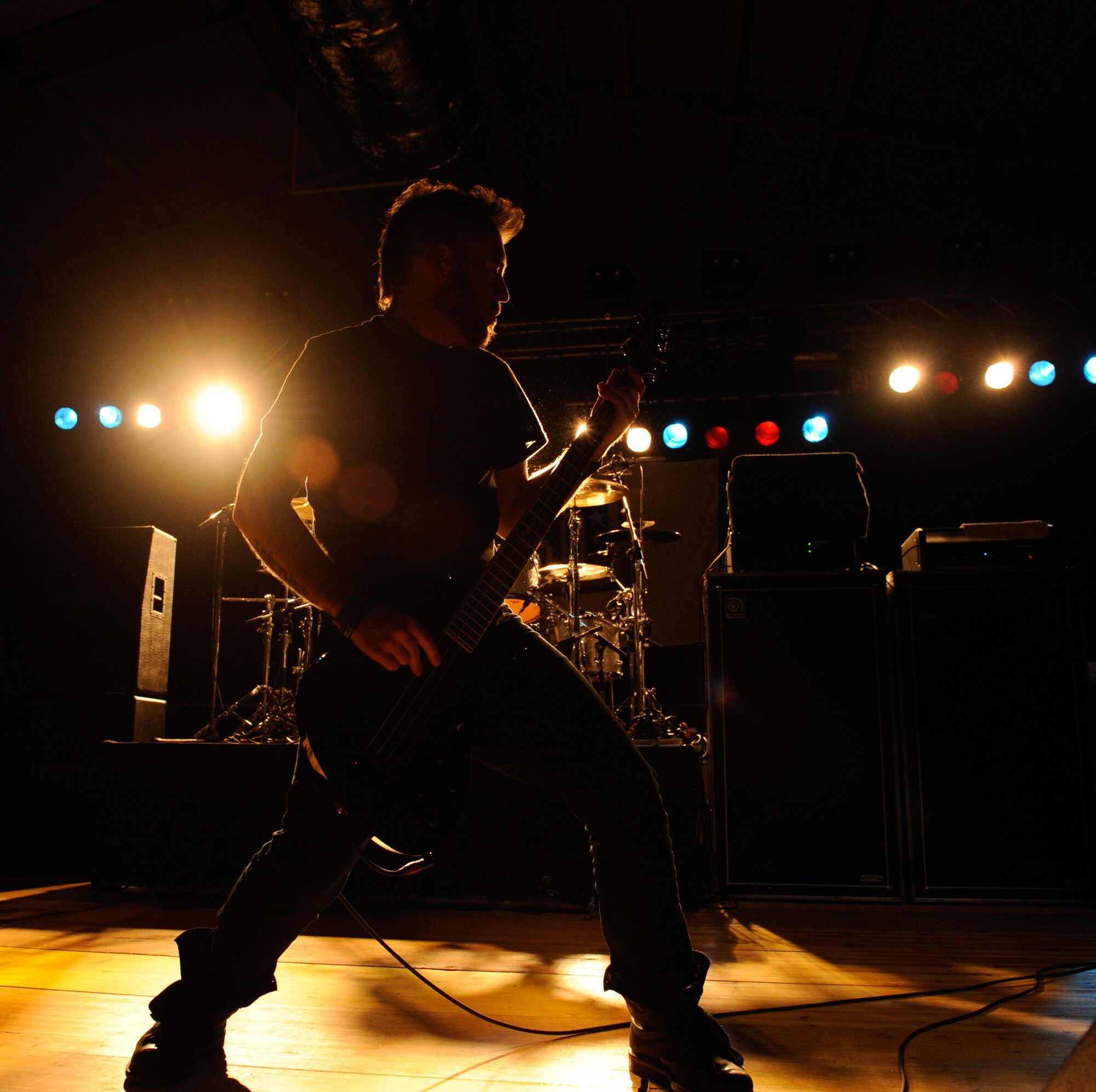 Dale Stewart, bassist for the band Seether, performs for Aviano Team members March 23, 2012, at Aviano Air Base, Italy. The hard-rock band visited Aviano as part of a USO tour through Italy and Turkey. (U.S. Air Force photo/Staff Sgt. Justin Weaver)