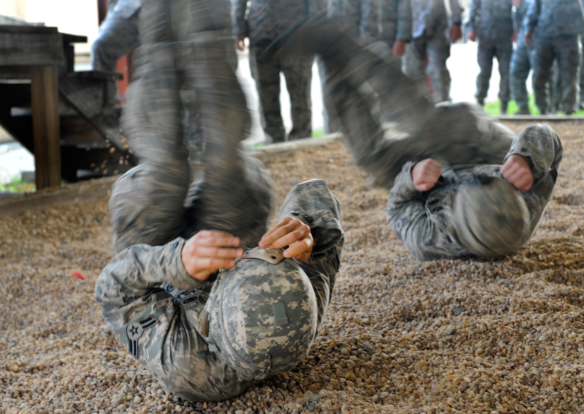 Moody members from the 820th Base Defense Group participate in landing training at Moody Air Force Base, Ga., March 21, 2012. This training helped prepare the Airmen for a landing during their static line parachute jump. (U.S. Air Force photo by Airman 1st Class Douglas Ellis/Released) 
