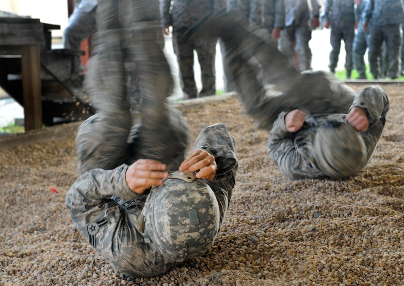 Moody members from the 820th Base Defense Group participate in landing training at Moody Air Force Base, Ga., March 21, 2012. This training helped prepare the Airmen for a landing during their static line parachute jump. (U.S. Air Force photo by Airman 1st Class Douglas Ellis/Released) 
