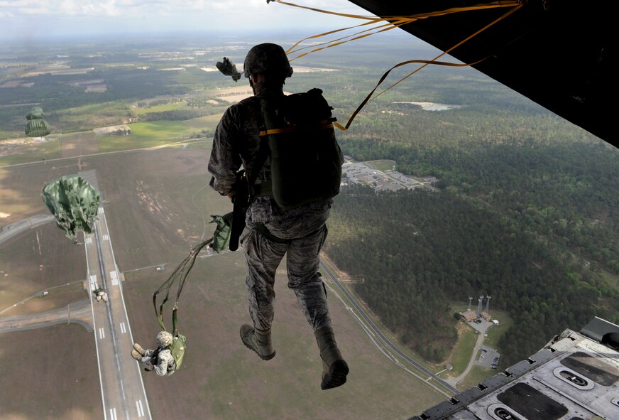 Moody members from the 820th Base Defense Group jump out of an HC-130P Combat King at Moody Air Force Base, Ga., March 21, 2012. There were a total of 30 Airmen who participated in the static line jump. (U.S. Air Force photo by Airman 1st Class Douglas Ellis/Released)
