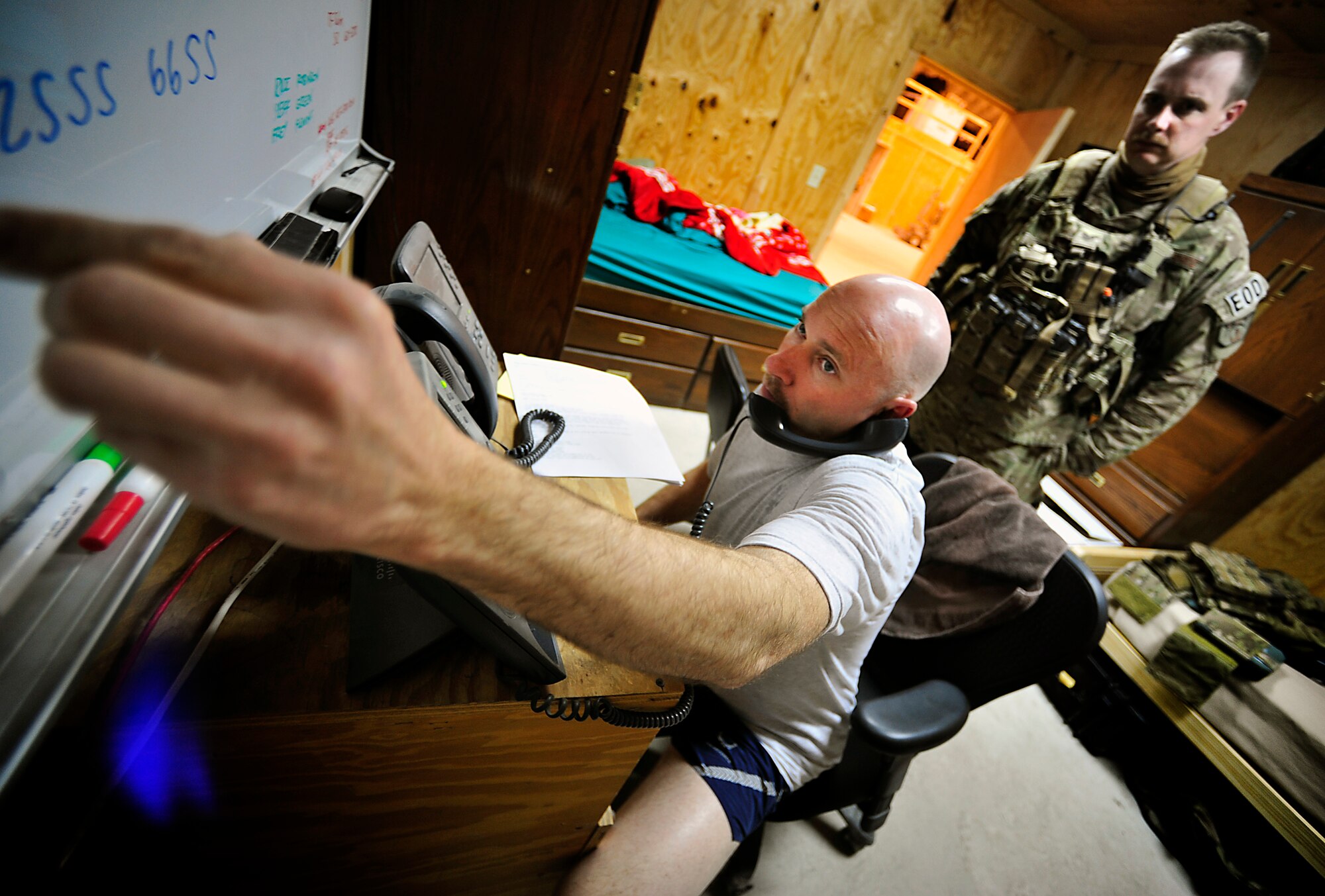 U.S. Air Force Senior Master Sgt. Brian D. Wade, Explosive Ordnance Disposal technician team leader with the 966th Air Expeditionary Squadron and Combined Joint Task Force Paladin, writes down information so that he can send his two three-man teams to respond after a multiple rocket attack inside the wire at Bagram Airfield, Afghanistan, March 20, 2012. The EOD flight with the 966th AES is tasked to mitigate, render safe, or destroy any conventional or unconventional explosive threat as well as chemical, nuclear or biological hazards inside and outside the wire. Their operations can be performed 24-hours a day, seven days a week. Some of their responsibilities as EOD technicians include mitigating improvised explosive devices, post blast analysis and route clearing packages. (U.S. Air Force photo/Staff Sgt. Sara Csurilla)