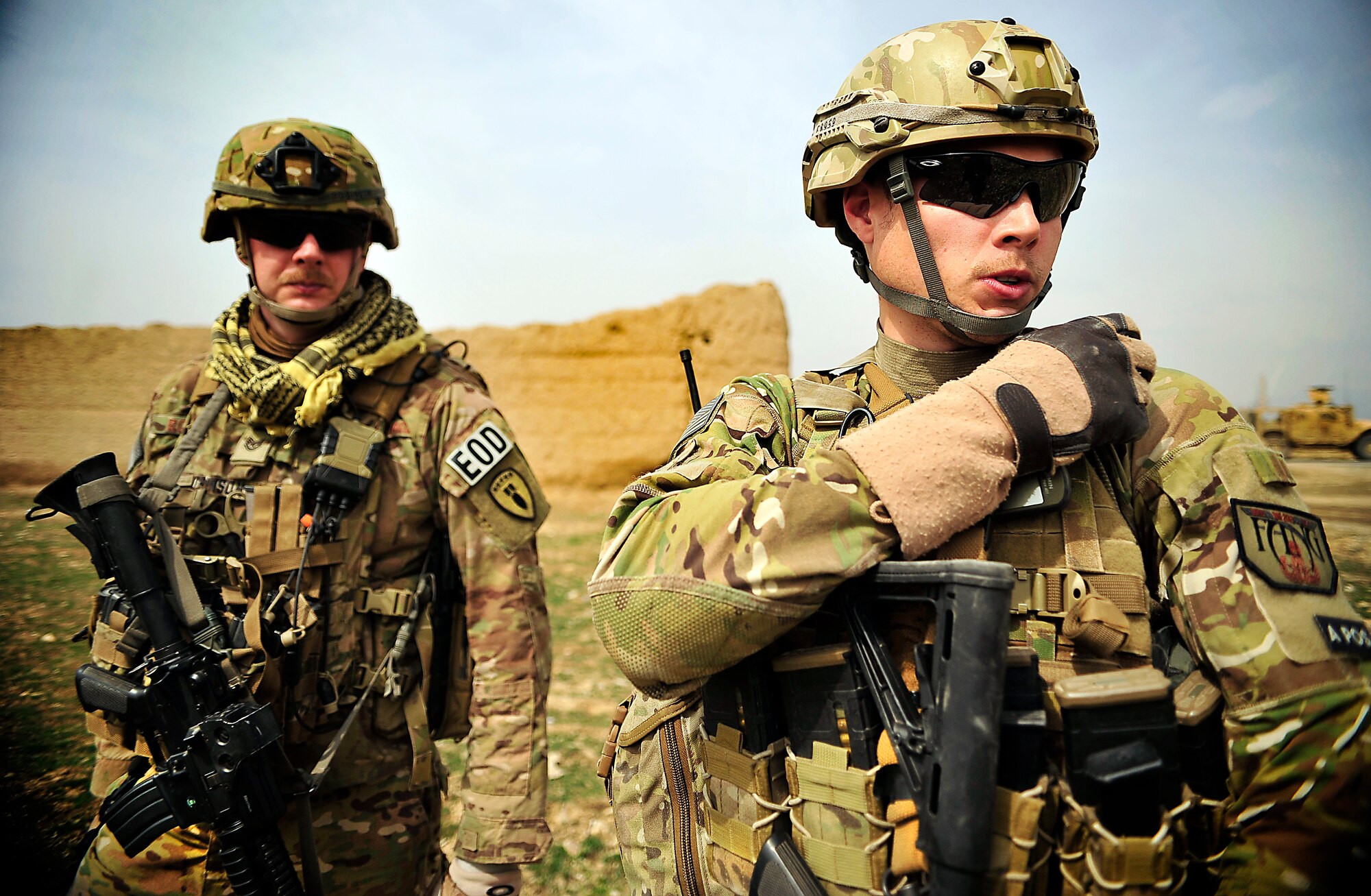 U.S. Air Force Staff Sgt. David Fleming calls back to his leadership as Tech. Sgt. Daniel K. Robinson waits for feedback during a call they responded to outside the wire that an unexploded ordnance was found at Bagram Airfield, Afghanistan, March 19, 2012. Fleming and Robinson are both Explosive Ordnance Disposal technicians with the 966th Air Expeditionary Squadron and Combined Joint Task Force Paladin. The EOD flight with the 966th AES is tasked to mitigate, render safe, or destroy any conventional or unconventional explosive threat as well as chemical, nuclear or biological hazards inside and outside the wire. Their operations can be performed 24-hours a day, seven days a week. Some of their responsibilities as EOD technicians include mitigating improvised explosive devices, post blast analysis and route clearing packages. (U.S. Air Force photo/Staff Sgt. Sara Csurilla)